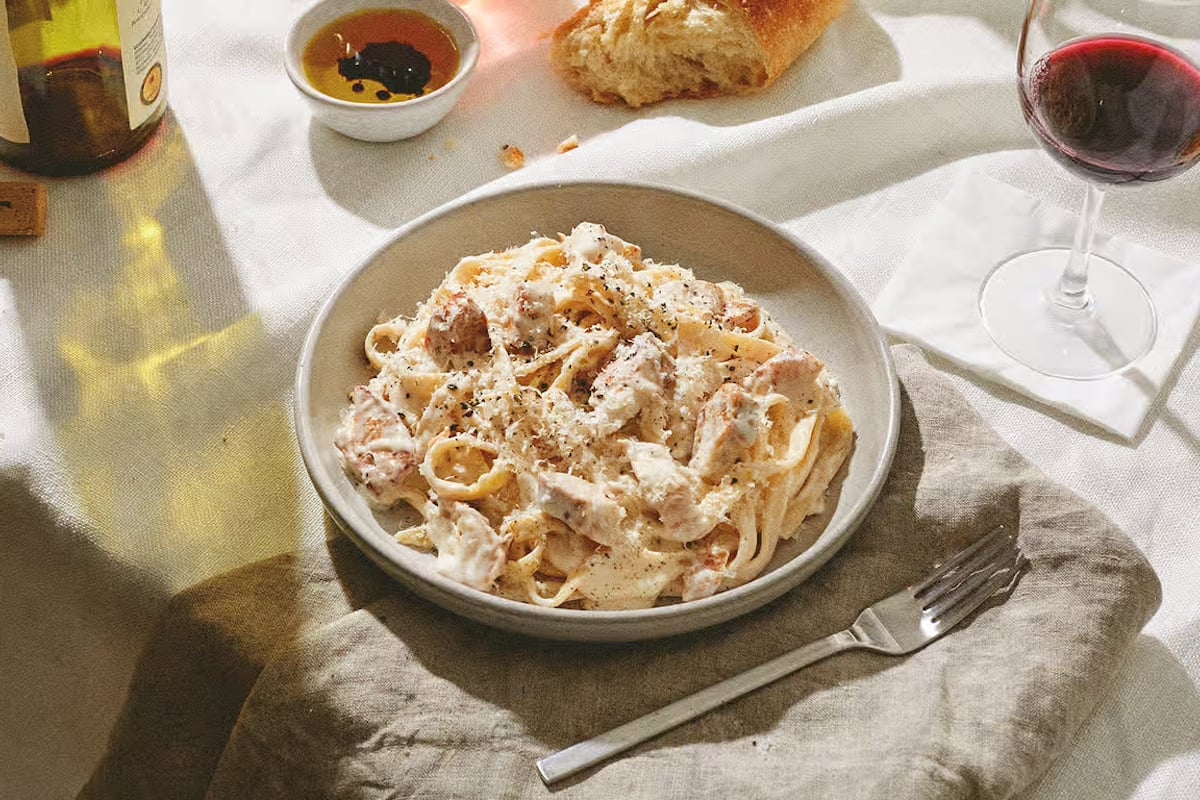 Chicken Fettuccine Alfredo (Grilled Chicken, Fettuccine, Alfredo sauce topped with fresh Parmesan cheese)