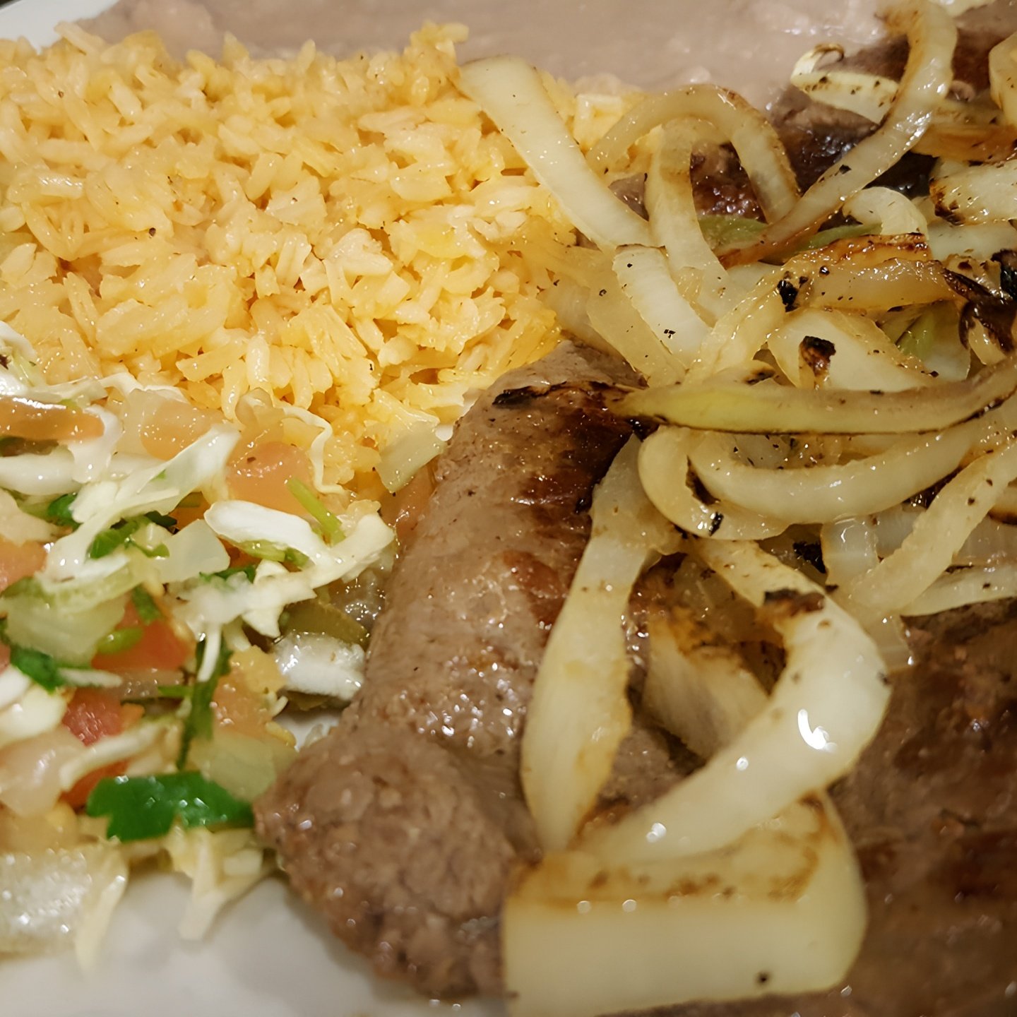 Bistec Encebollado.