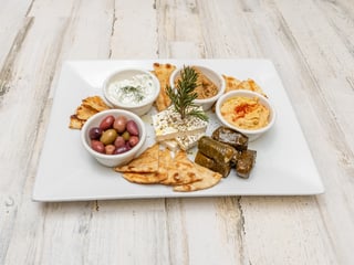 Myrtos Spread Platter- dolmades,feta, tzatziki, melitzanasalata, hummus & pita