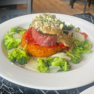 Steak Over Potato Cake