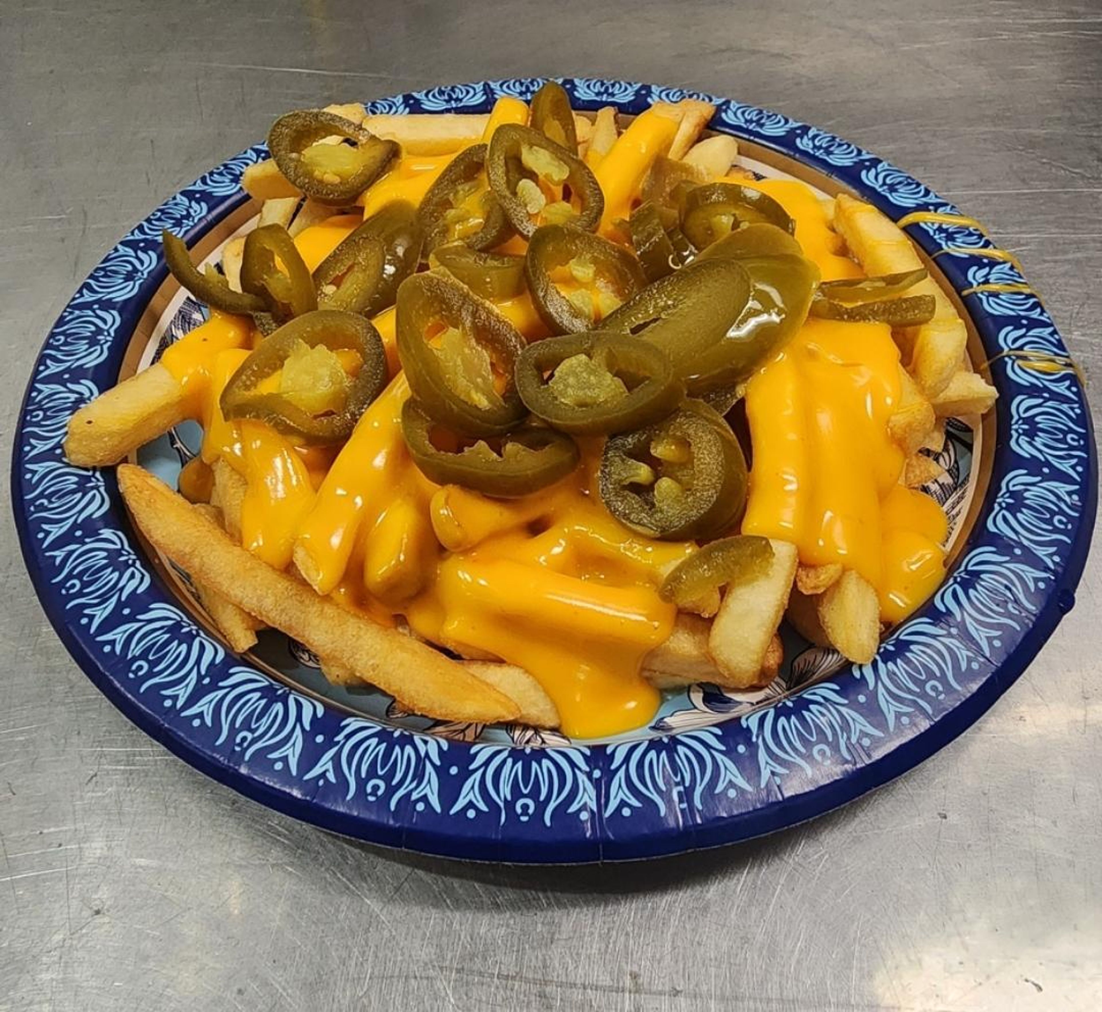 Nacho cheese fries & jalapeños.