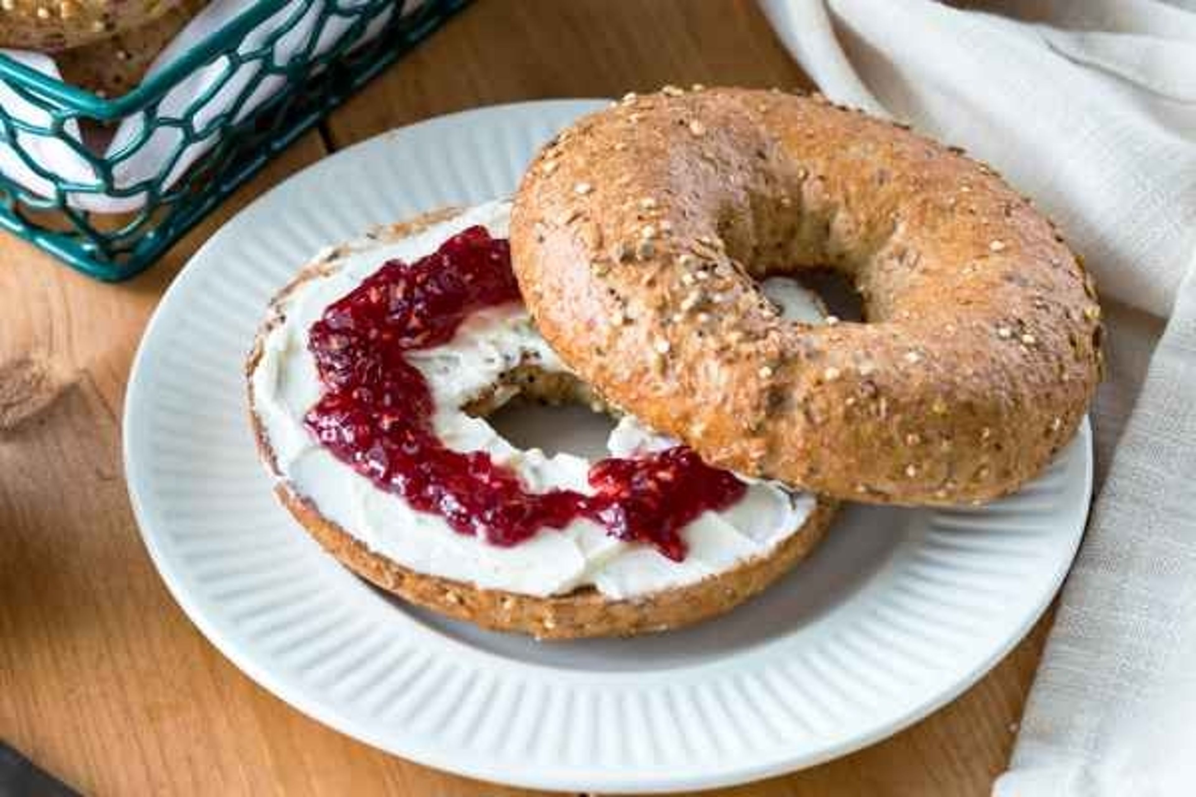 Toasted Bagel with Cream Cheese and Jelly.