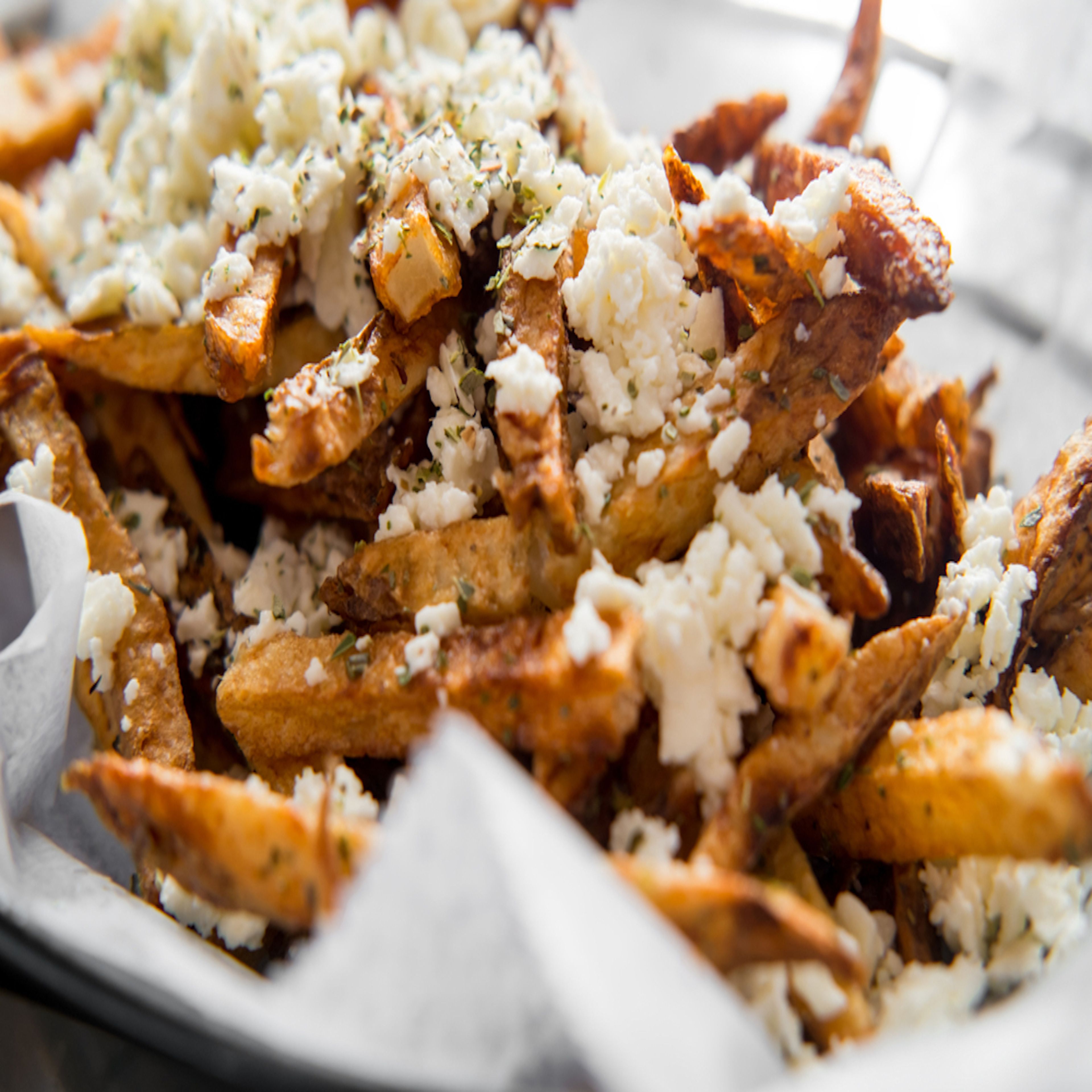 GREEK FRIES W/ FETA CHEESE.