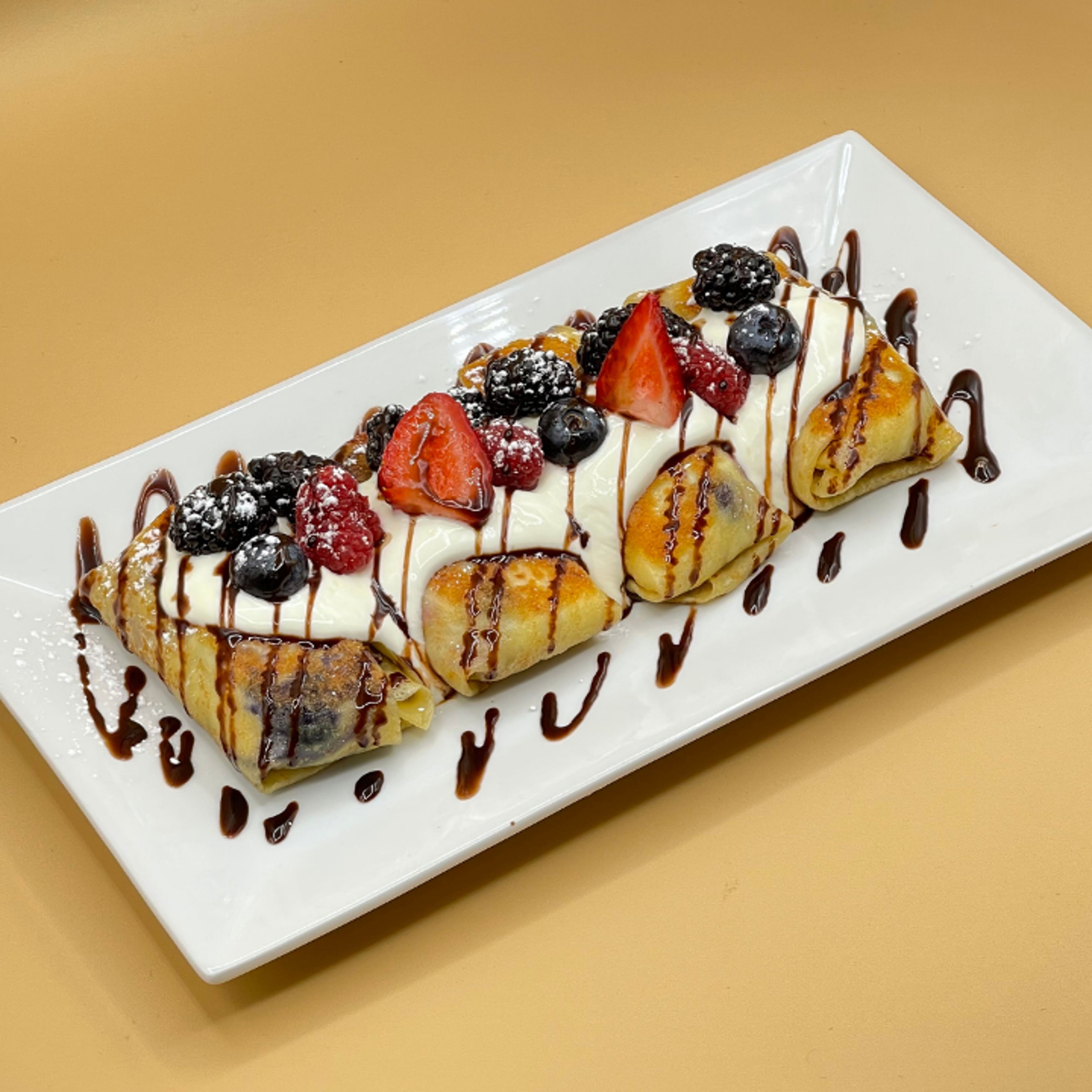 Nalesniki (Farm cheese, bananas and strawberries).