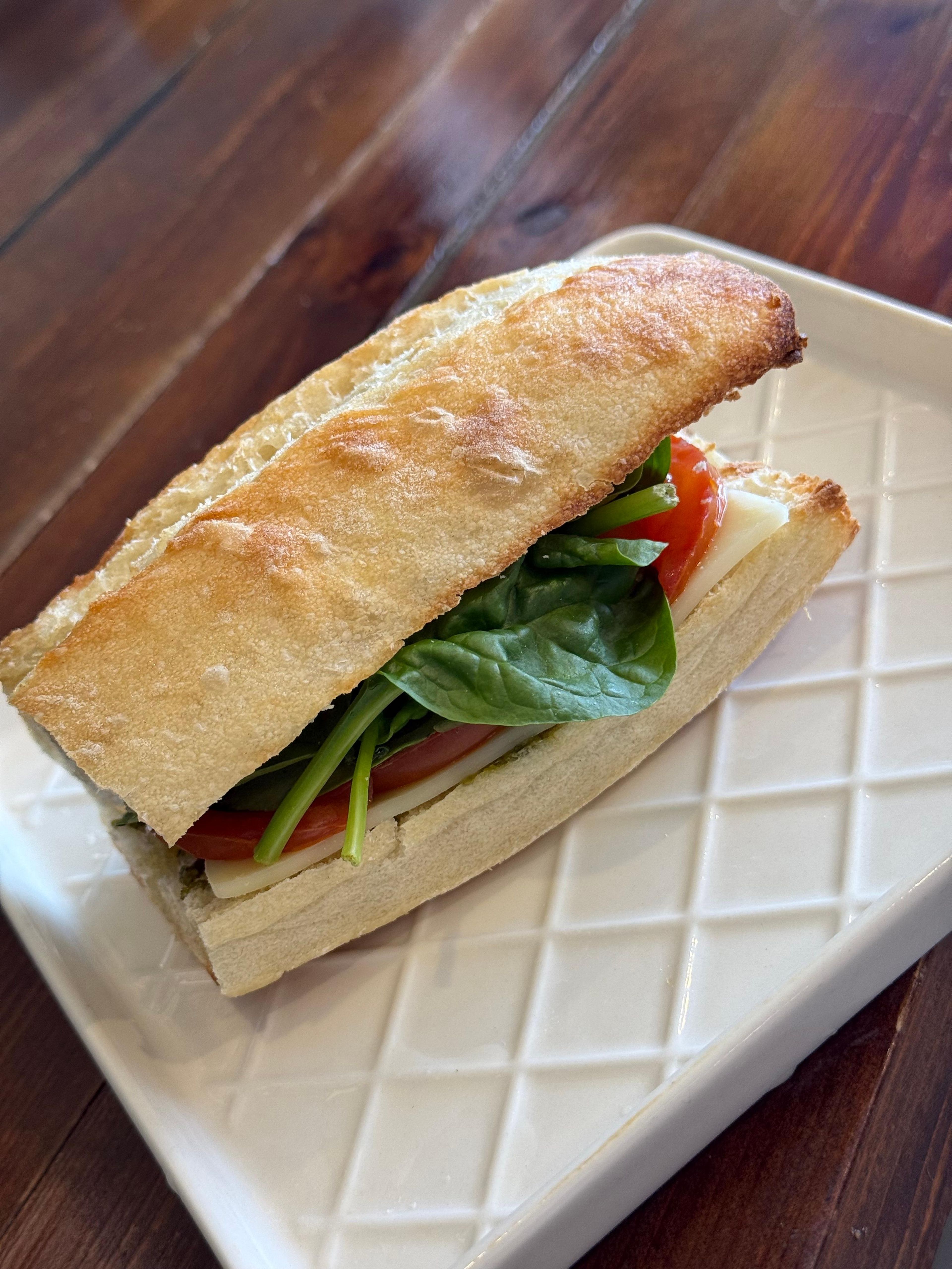 SPINACH PROVOLONE TOMATO SANDWICH.