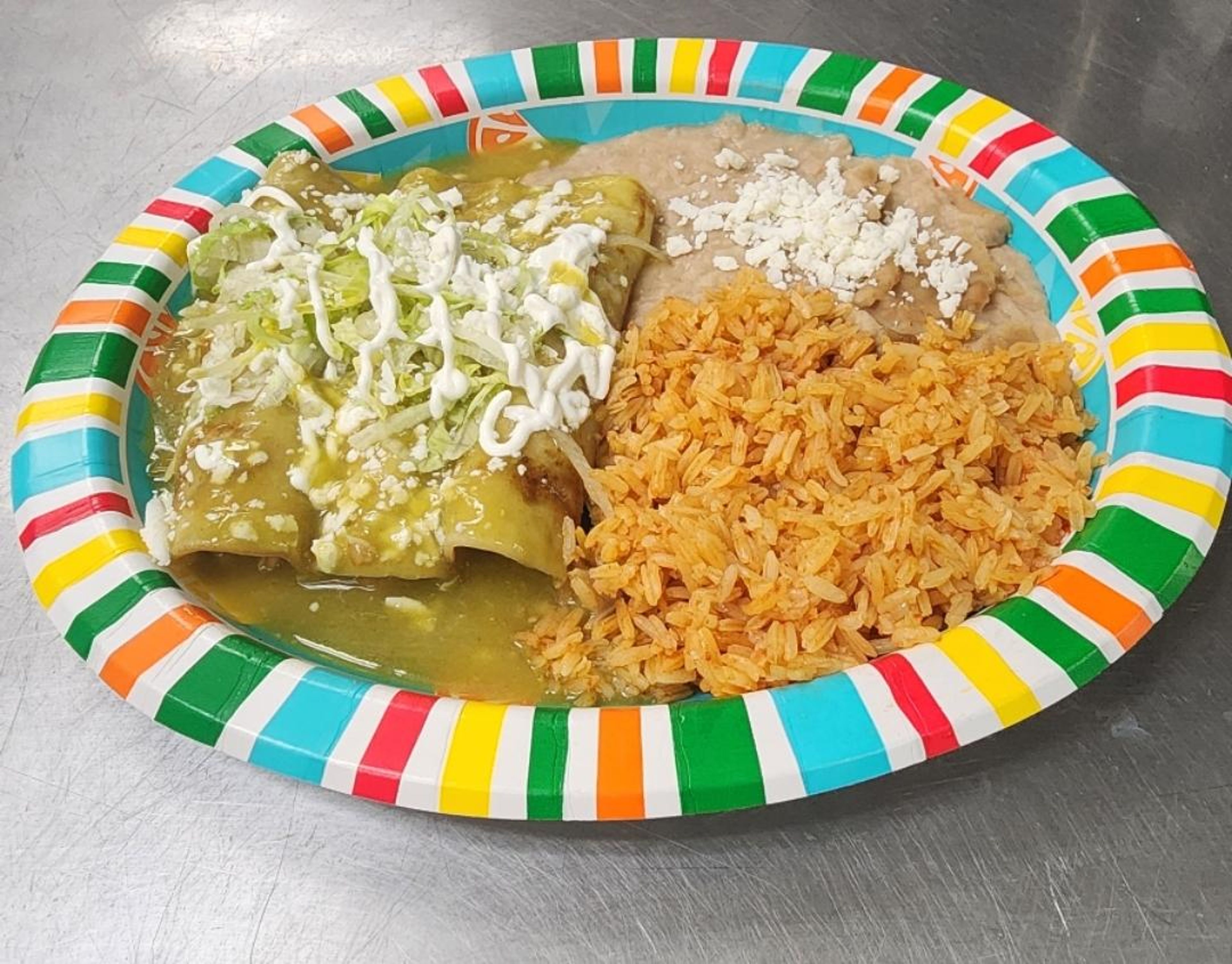 3 chicken green enchiladas , Beans, Rice.