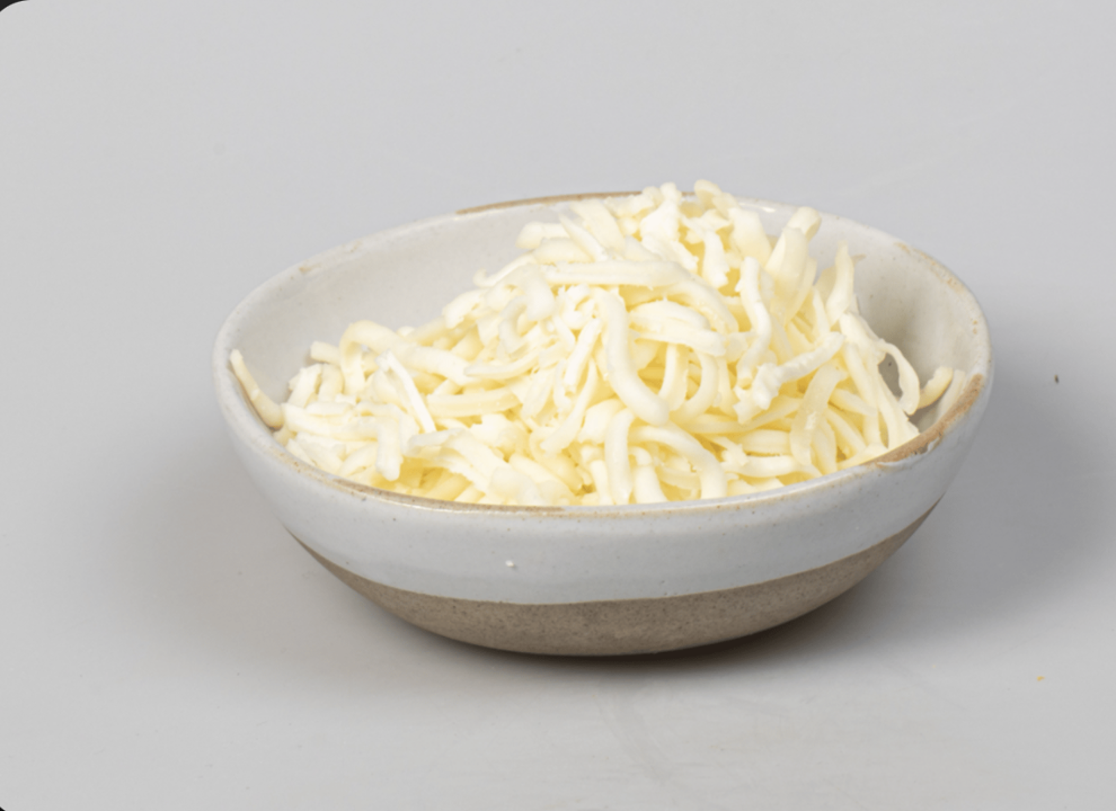 Shredded White Cheese Side.