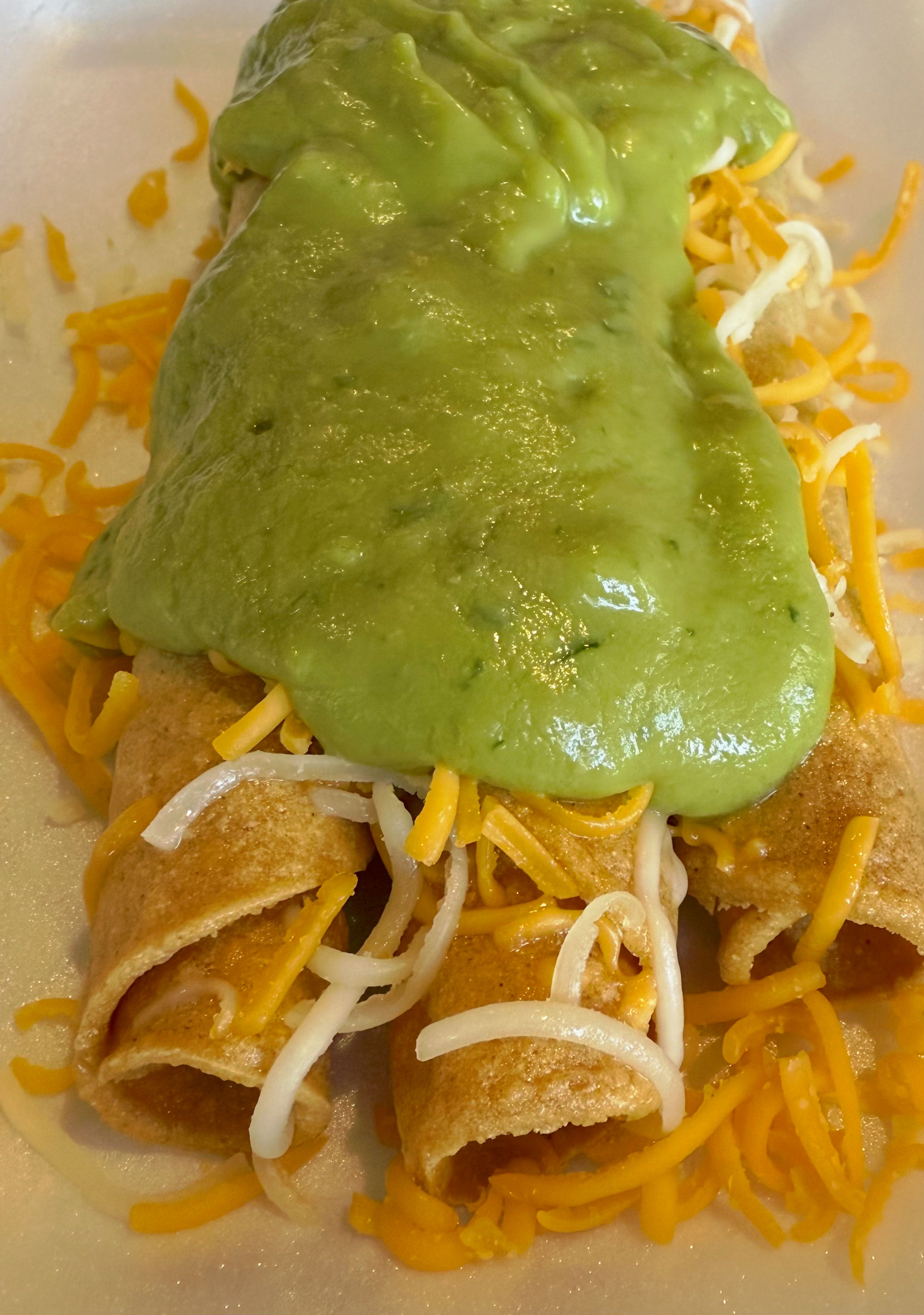 3 Rolled Tacos with Cheese and Guac.
