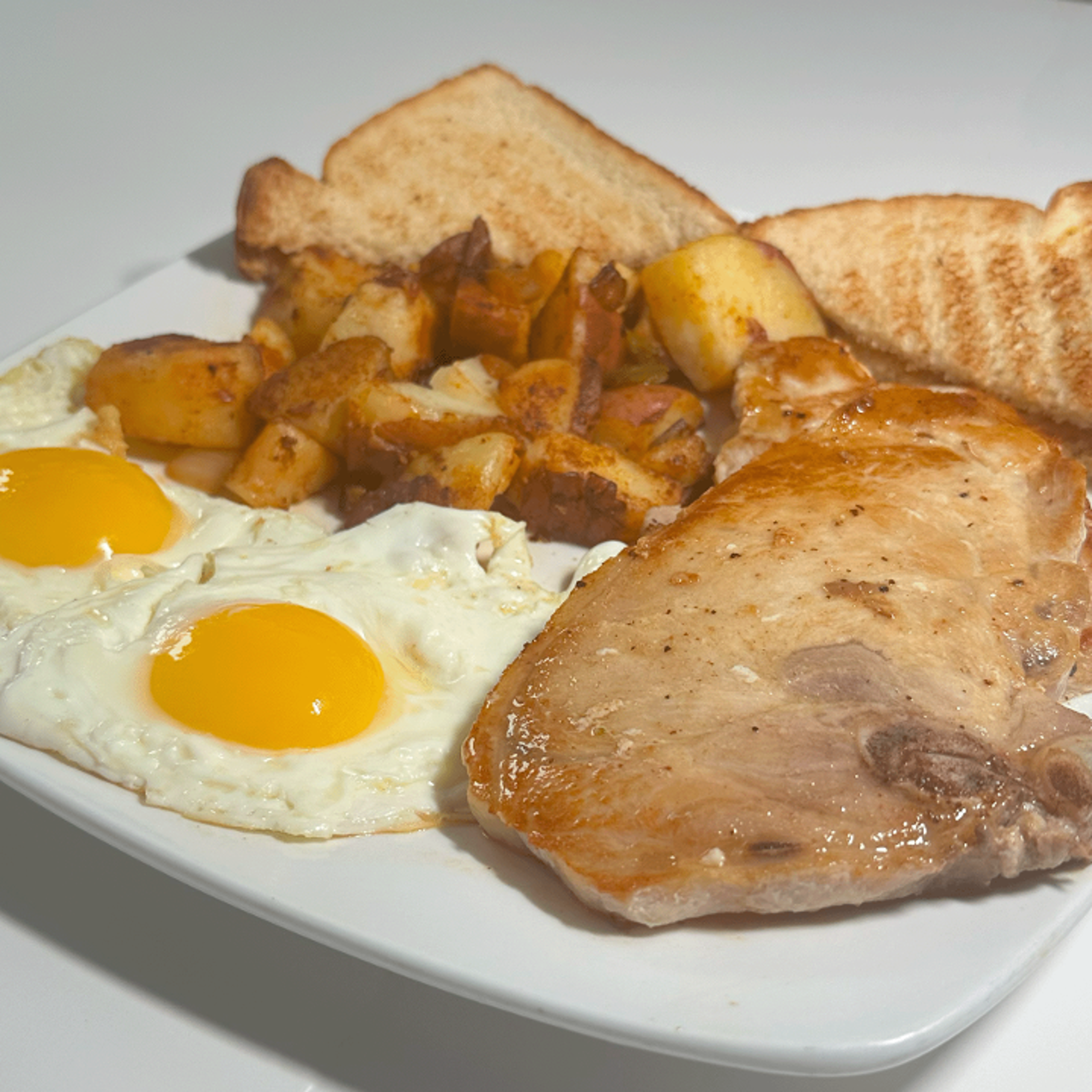 PORK CHOPS AND EGGS.