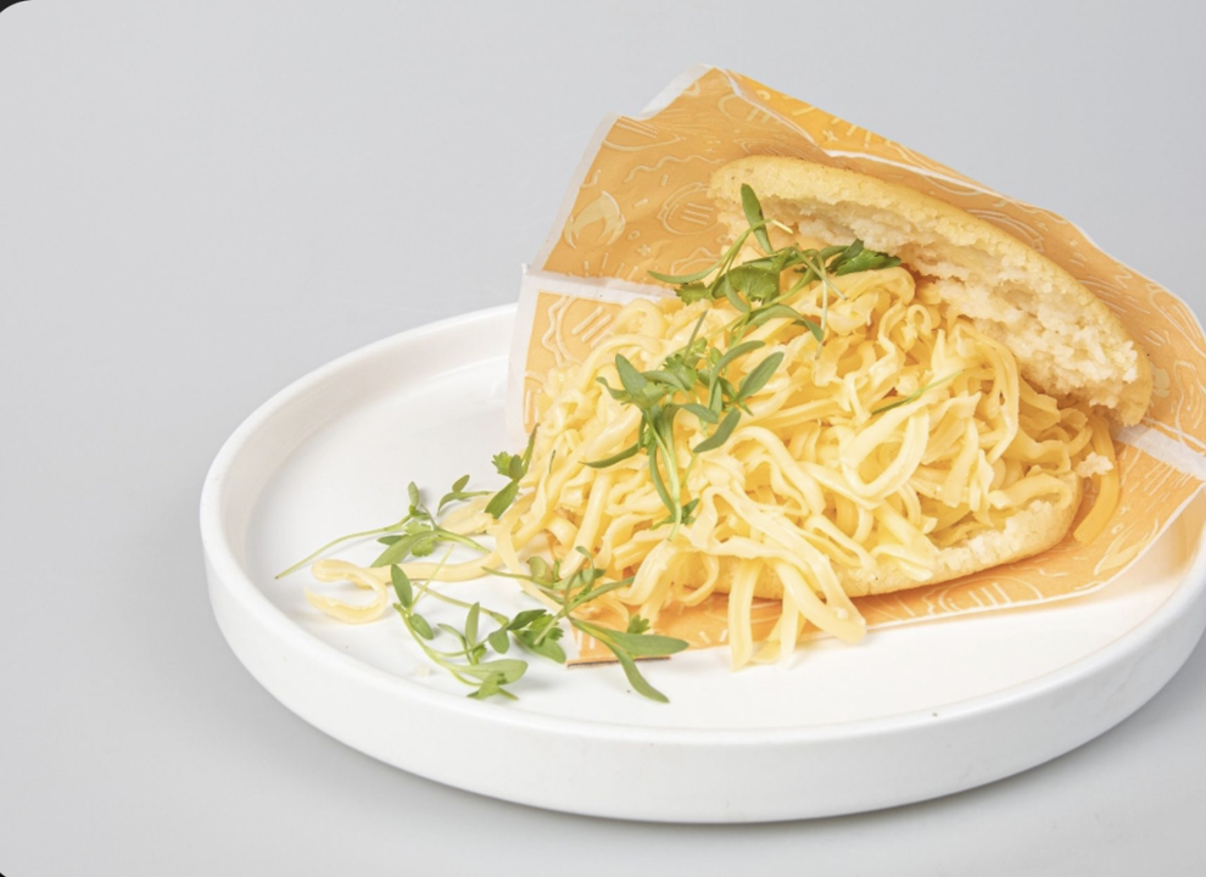 Arepa with Shredded yellow cheese.