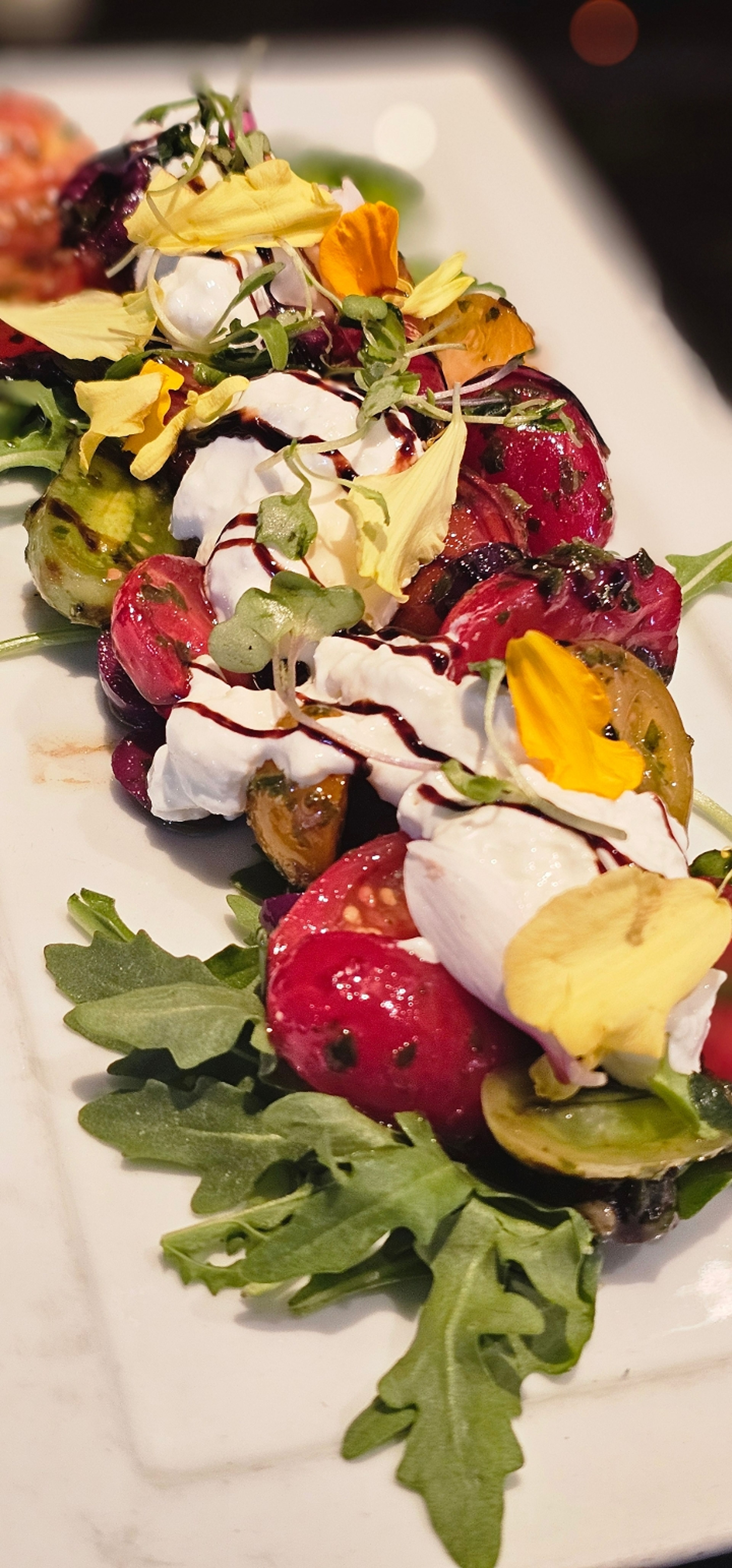 Burrata & Organic Heirloom Tomatoes*.