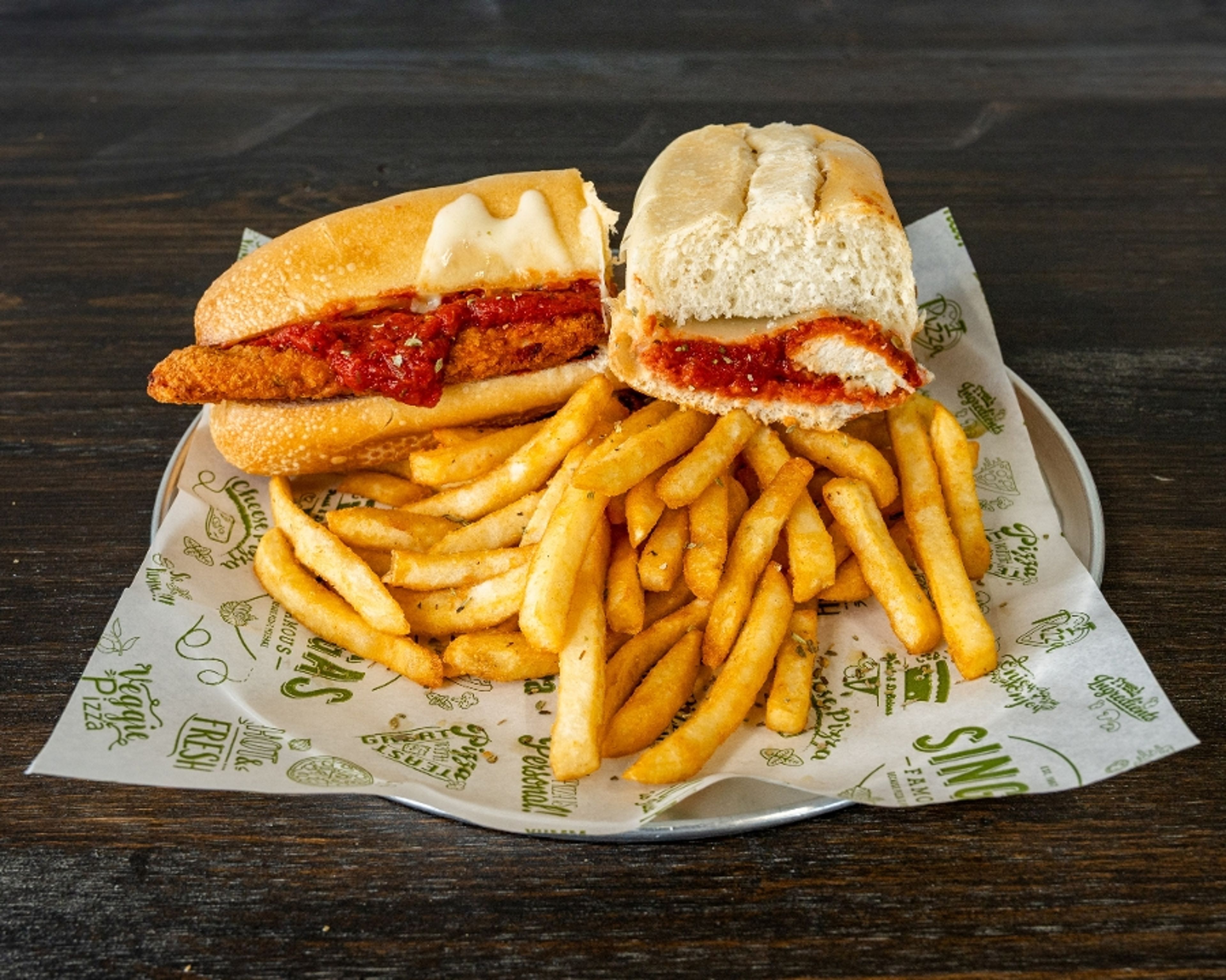 Parmigiana Sandwich with fries.