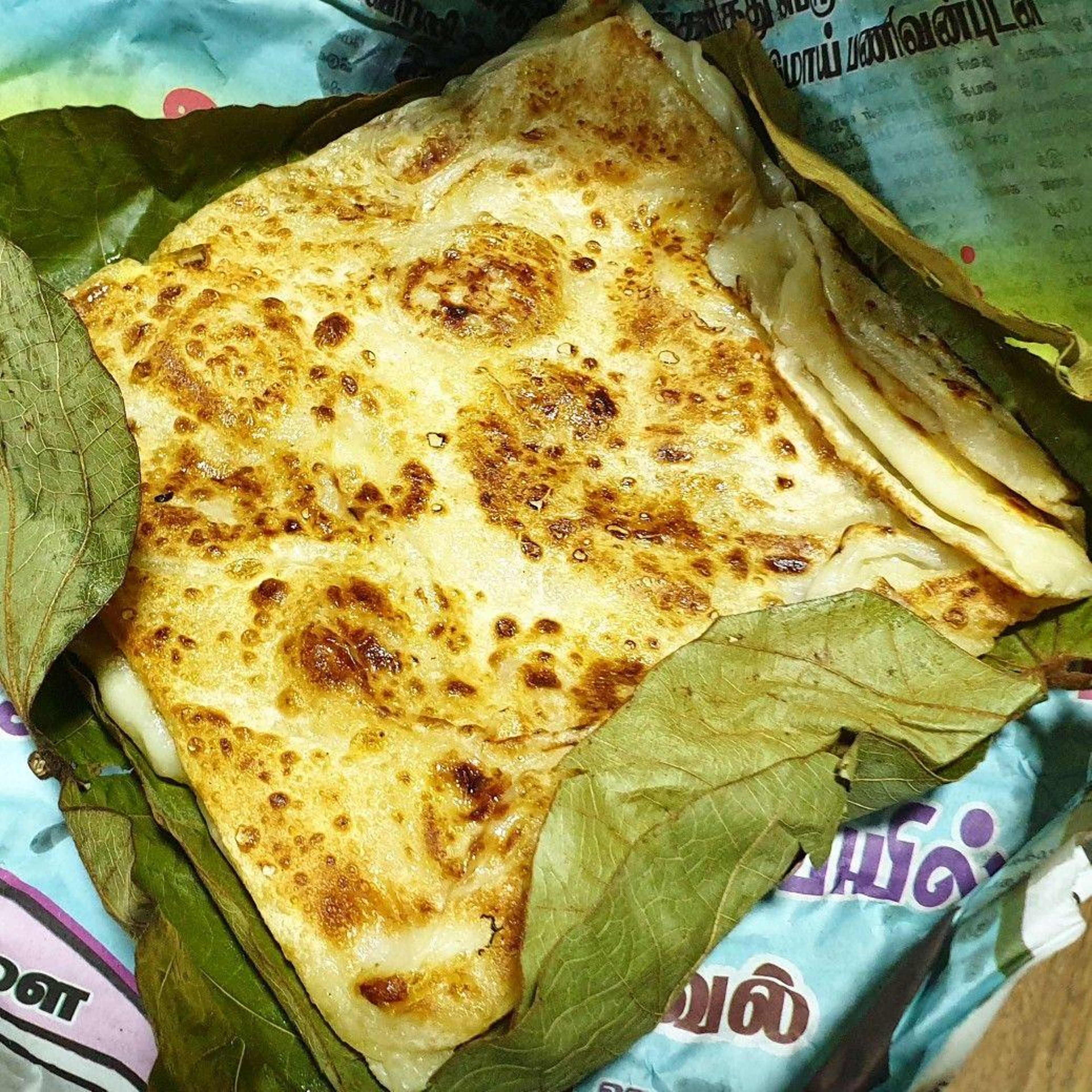 TREASURE PARATHA IN BANANA LEAF (KIZHI PORRATA).