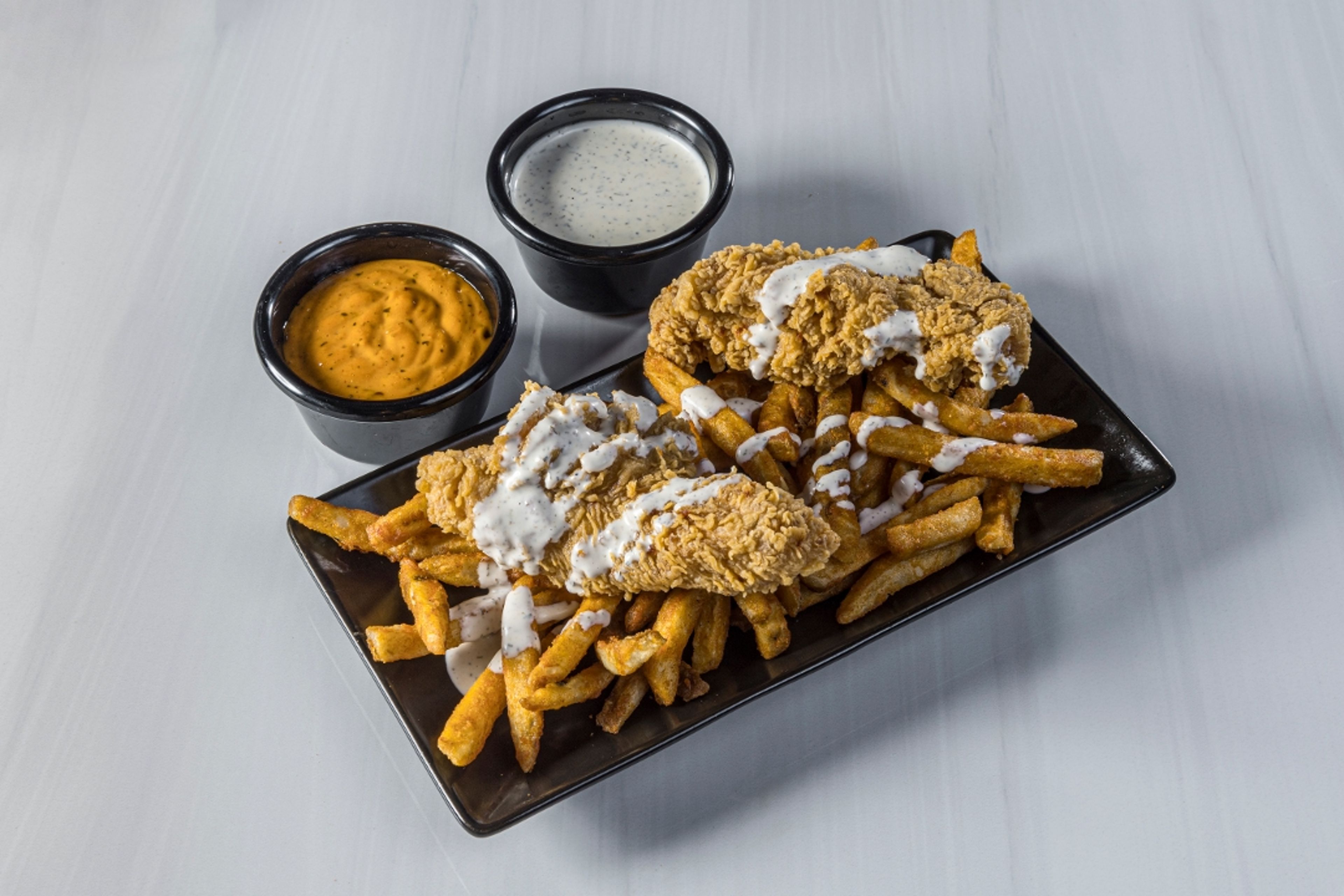 Fried Tender Over Fries.