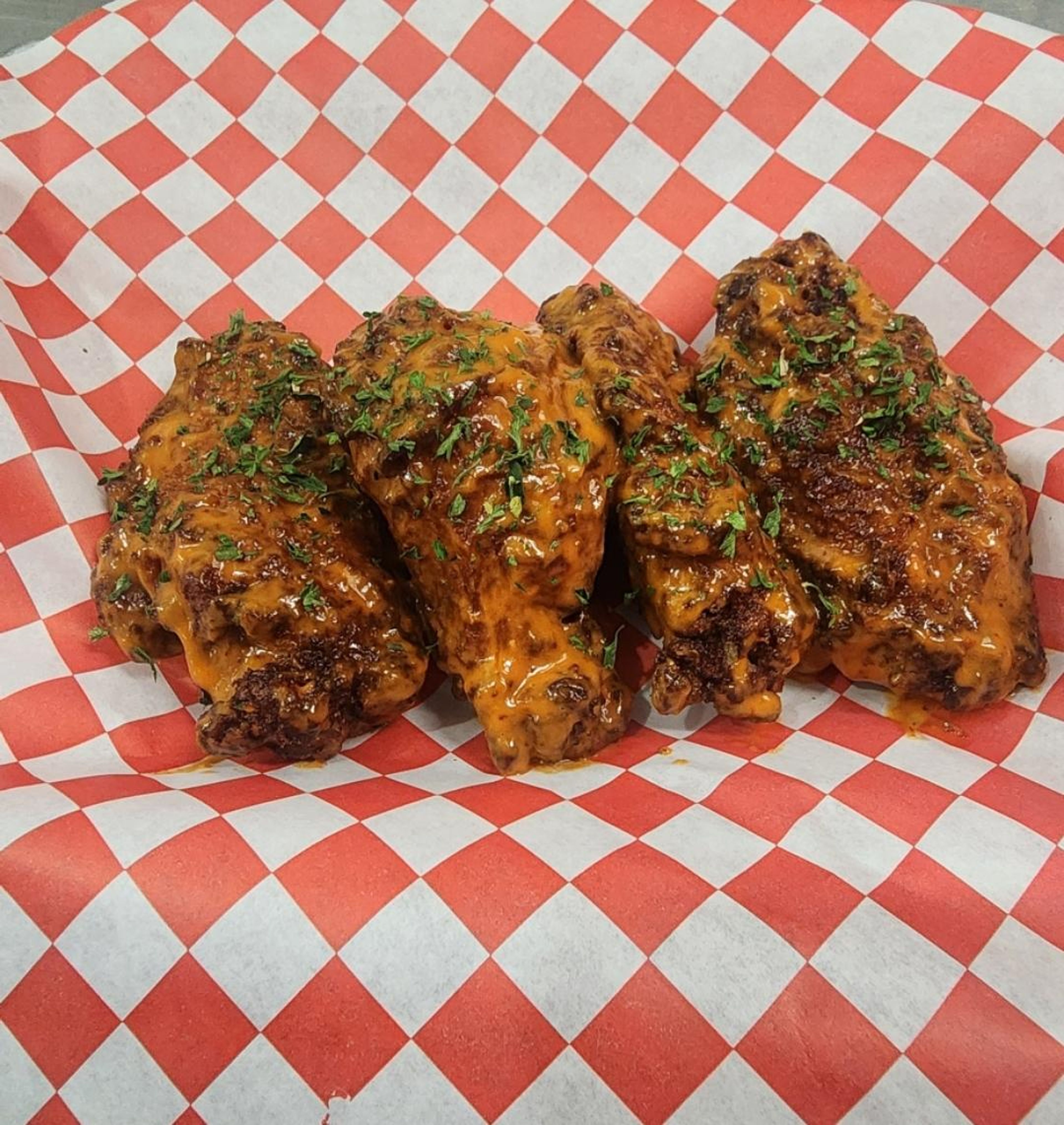 GARLIC Buffalo  wings with parsley.