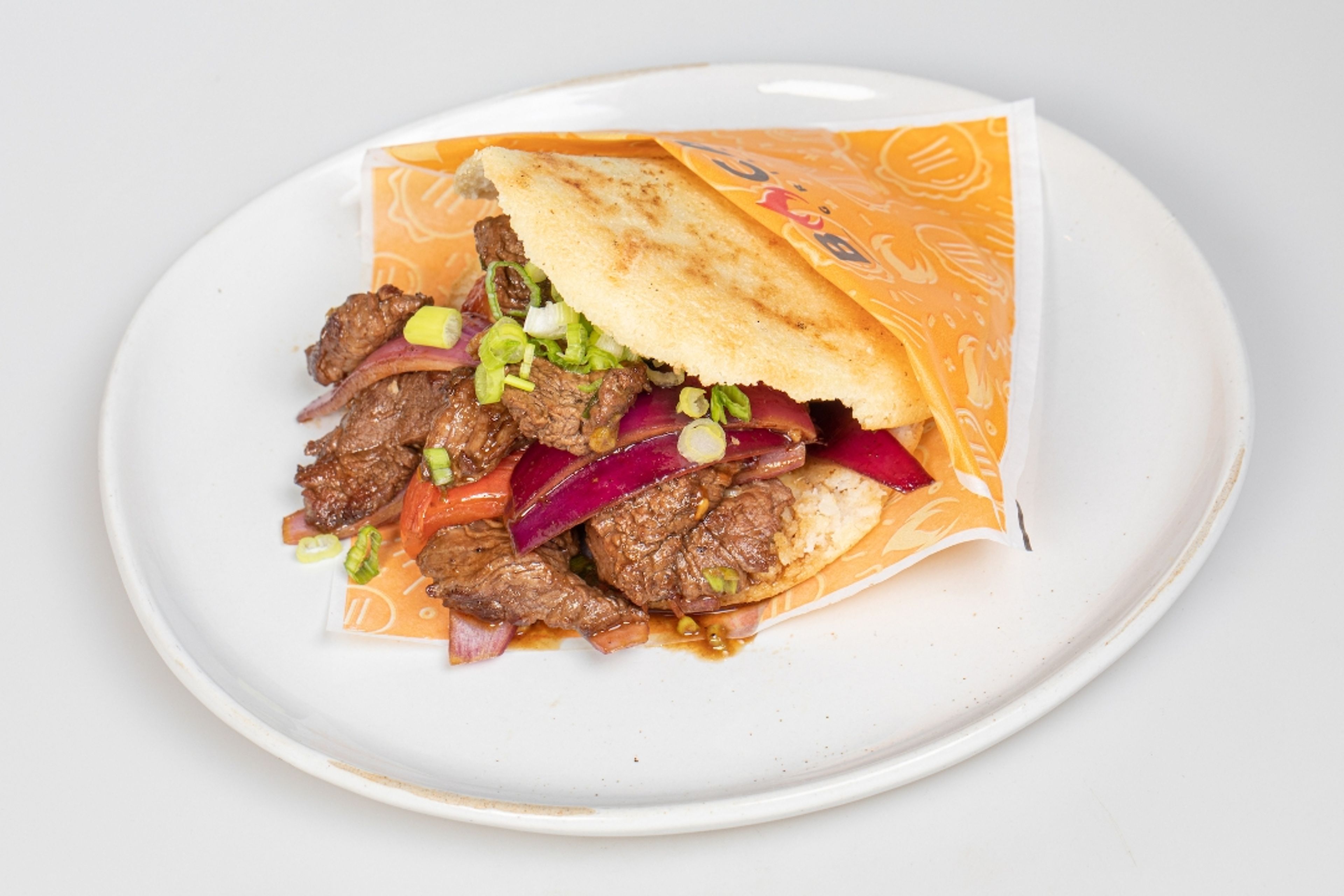 Arepa Wok Smoked Lomo.