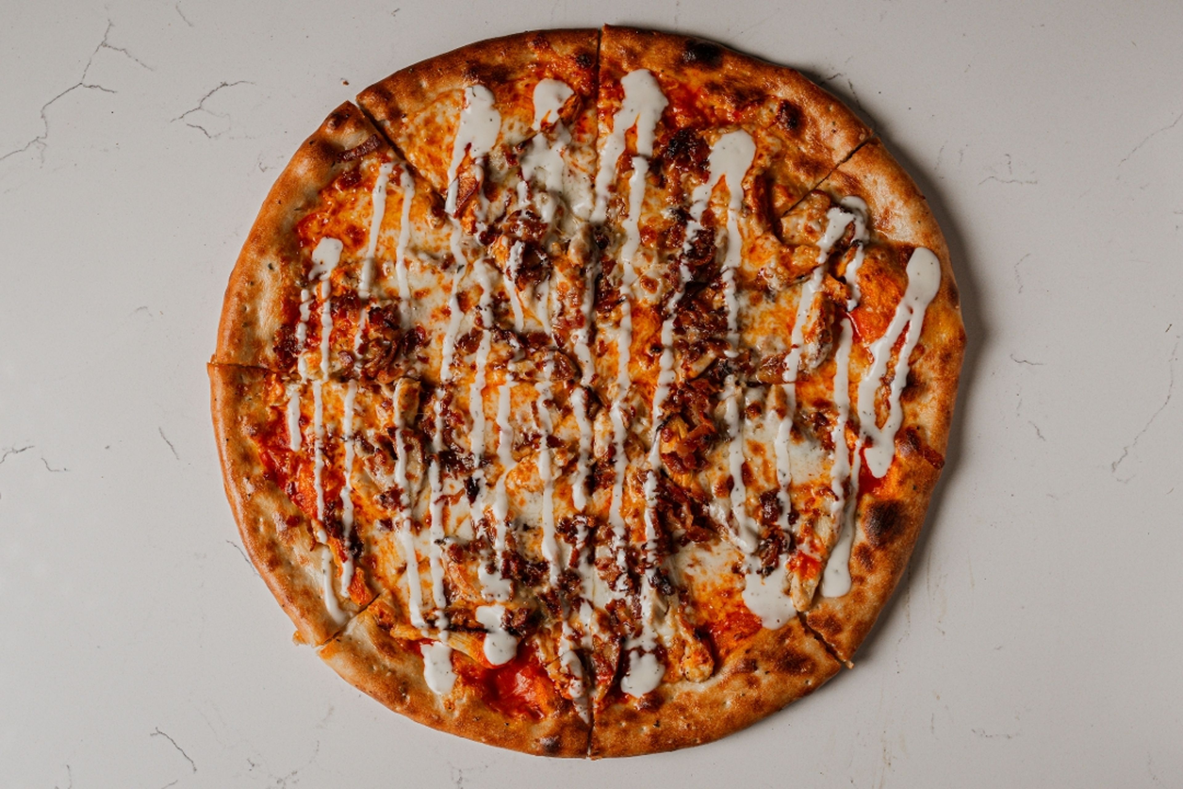 Buffalo Chicken Bacon Ranch Pizza.