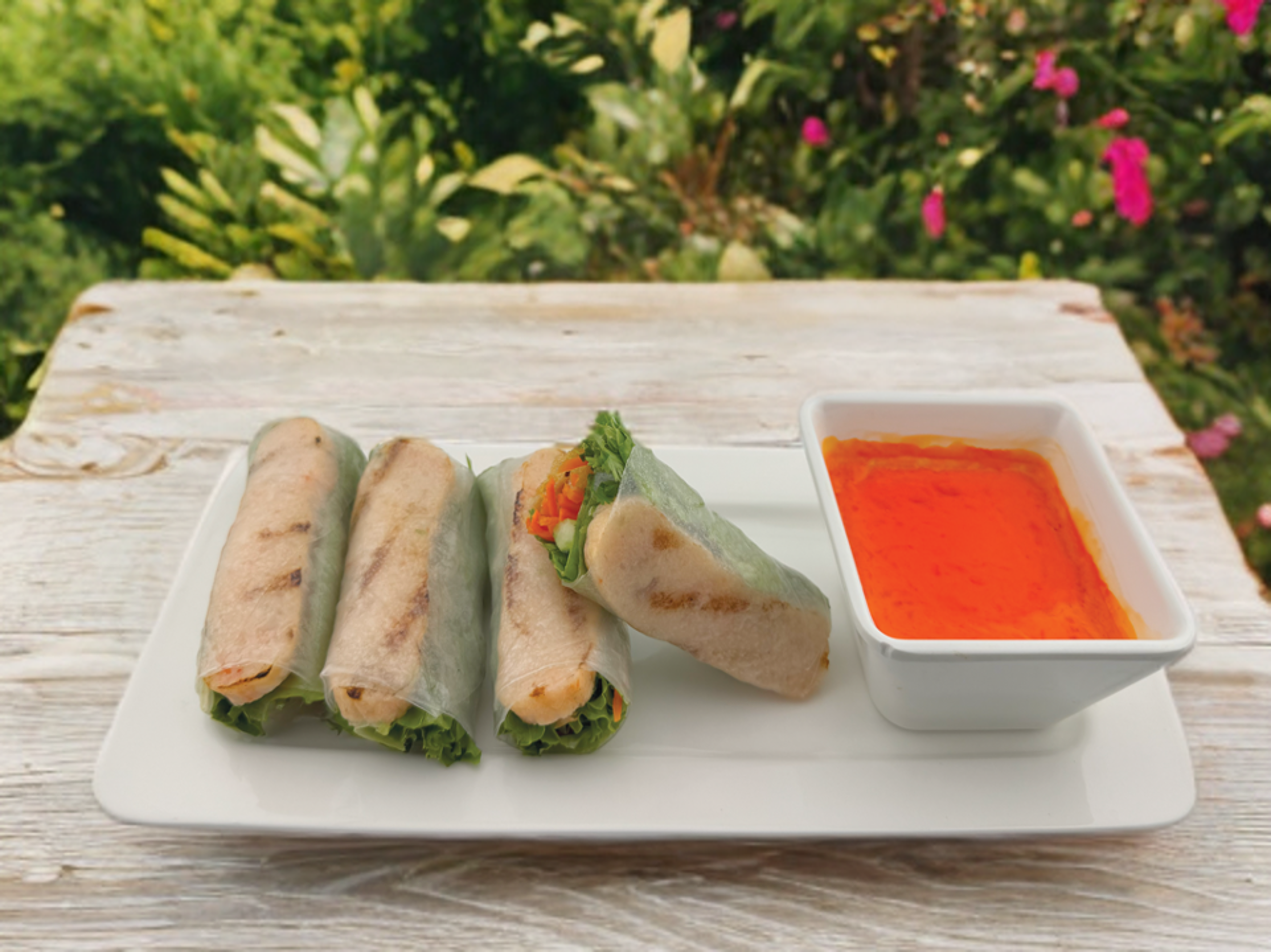 Grilled Sugar-Cane shrimp Spring rolls.