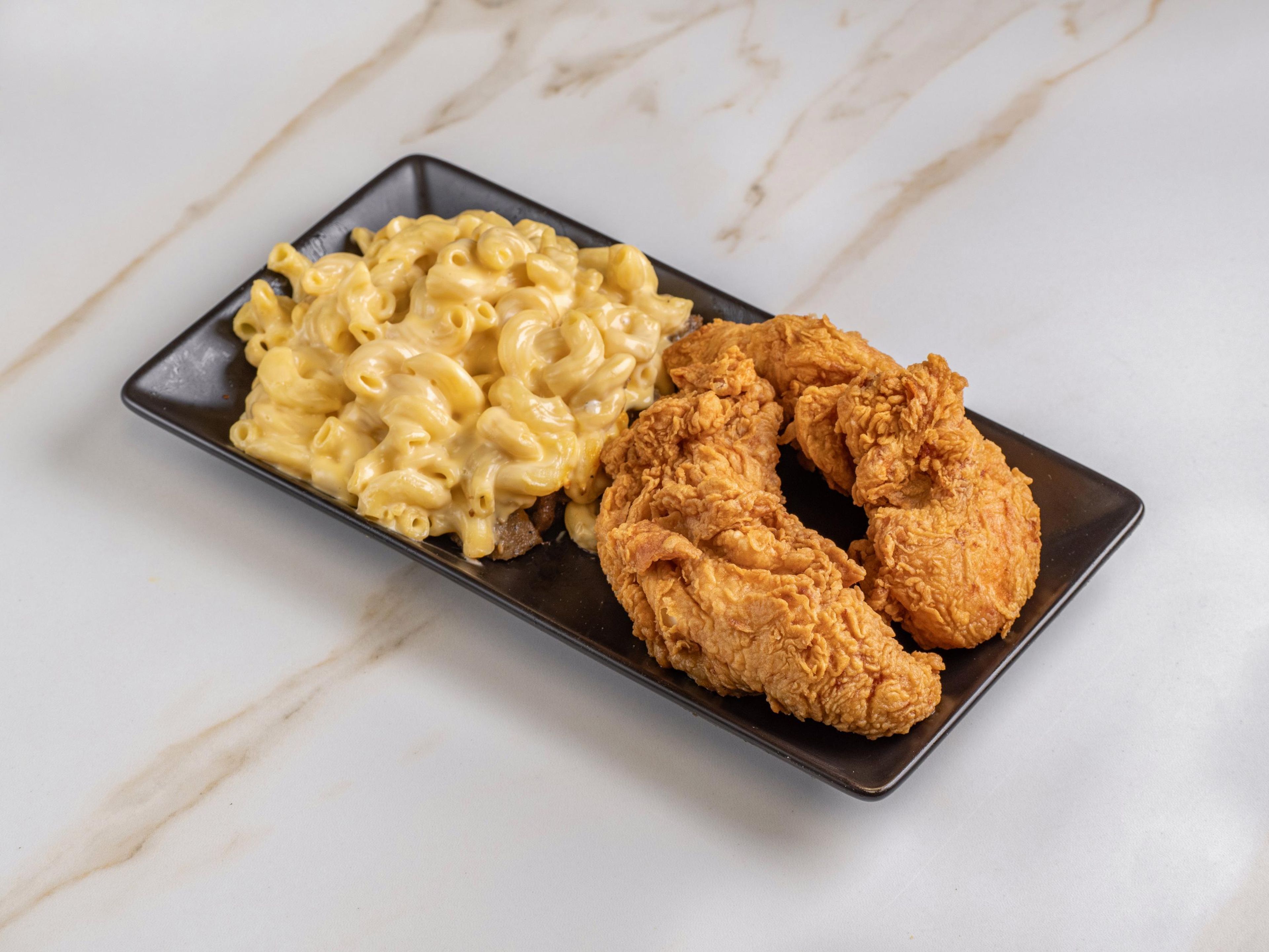 Fried Tender Over Mac & Cheese.