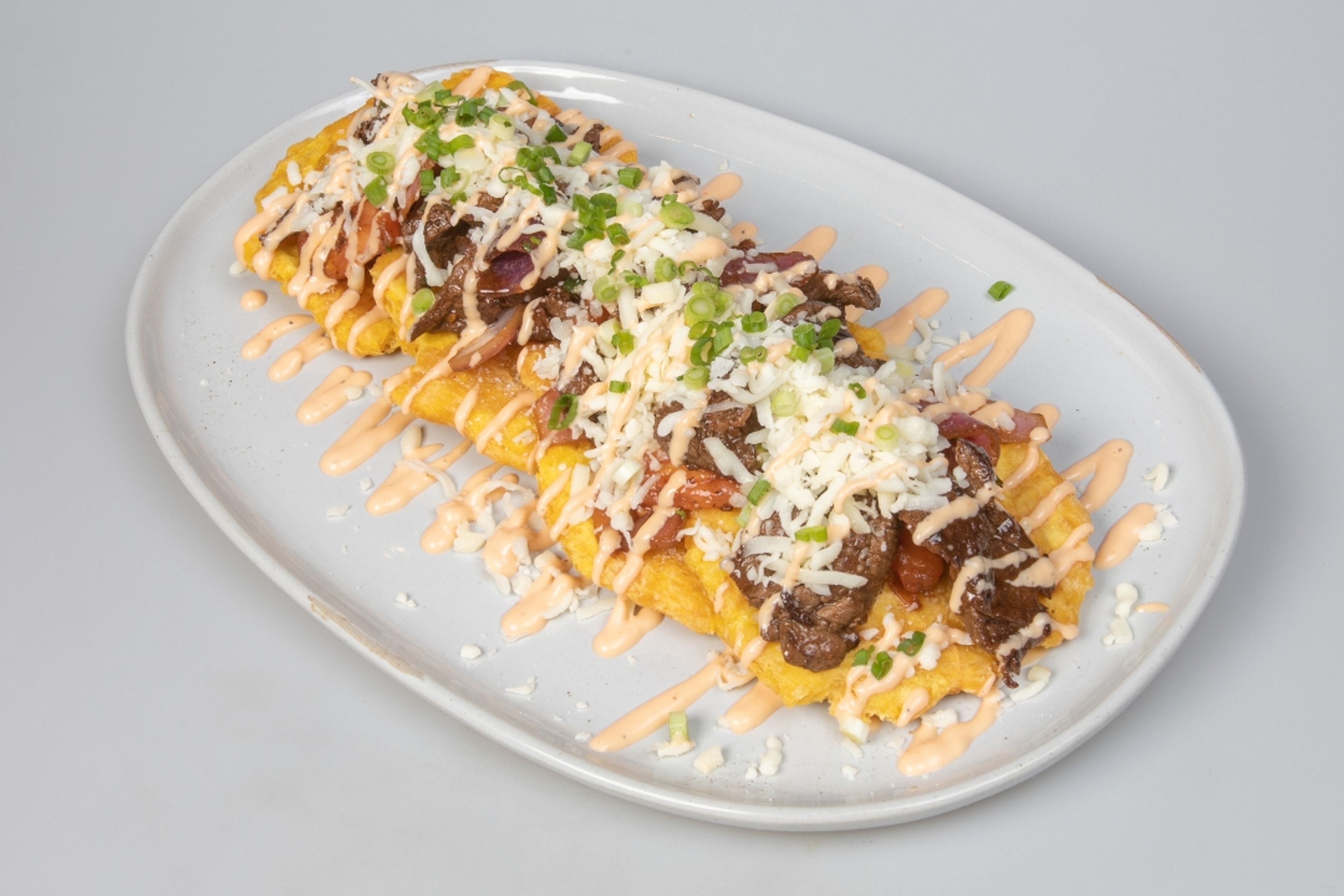 Fried Green Plantains with Lomo.