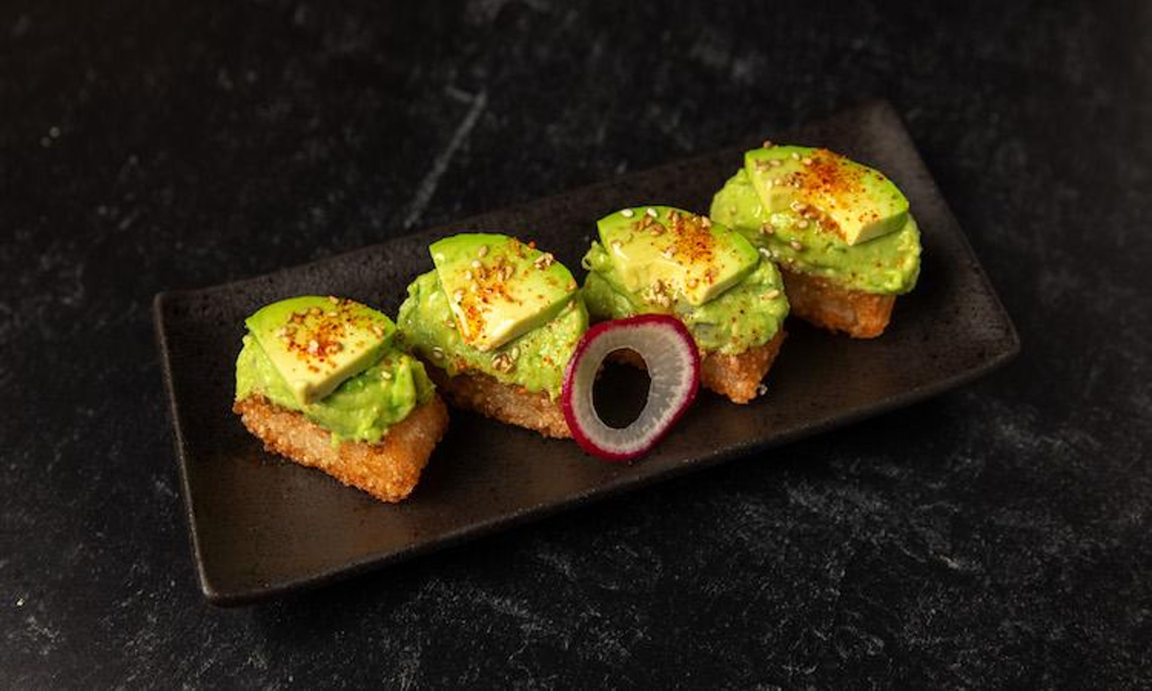 Crispy Rice Avocado & Truffle Oil.