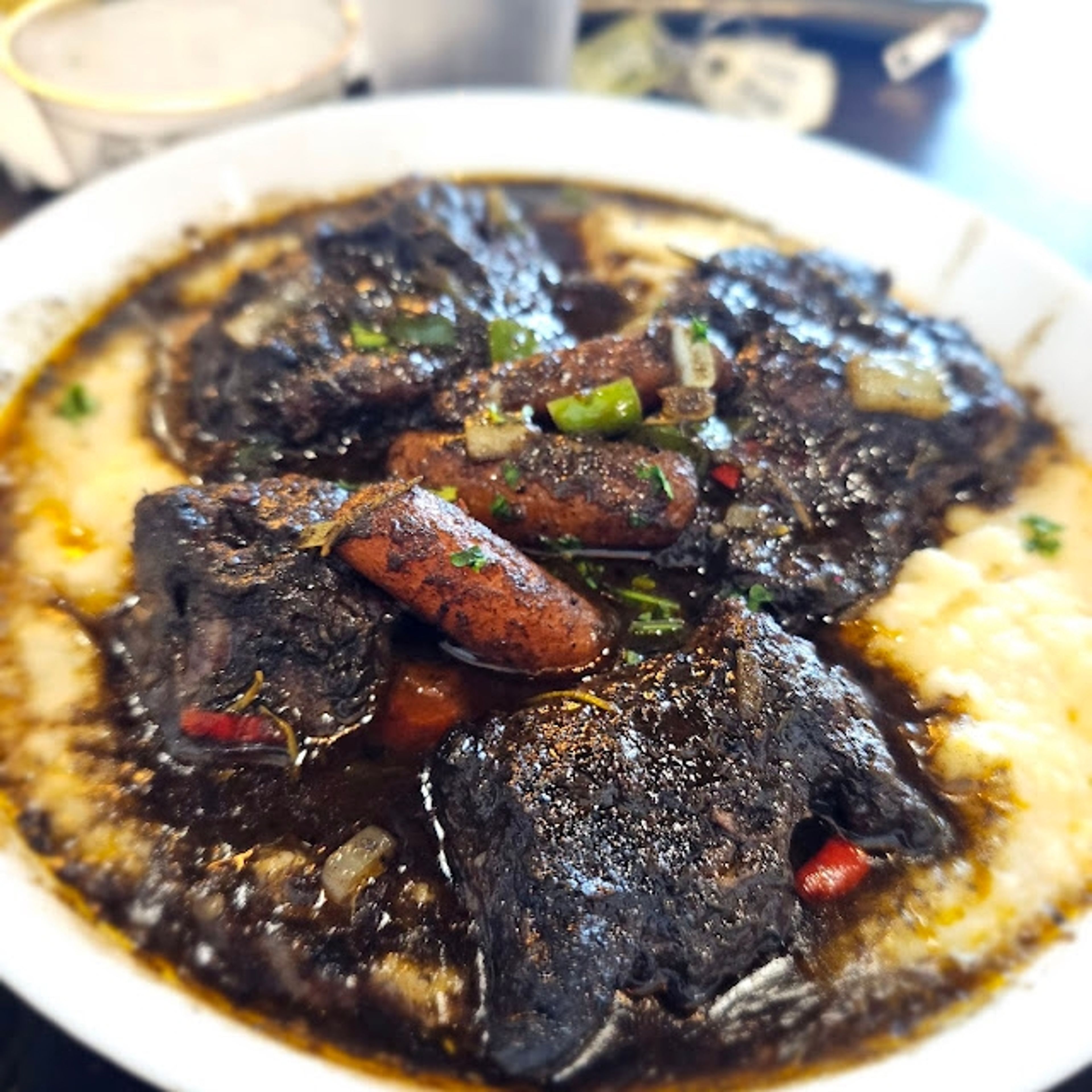 Jerk Oxtails & Grits.