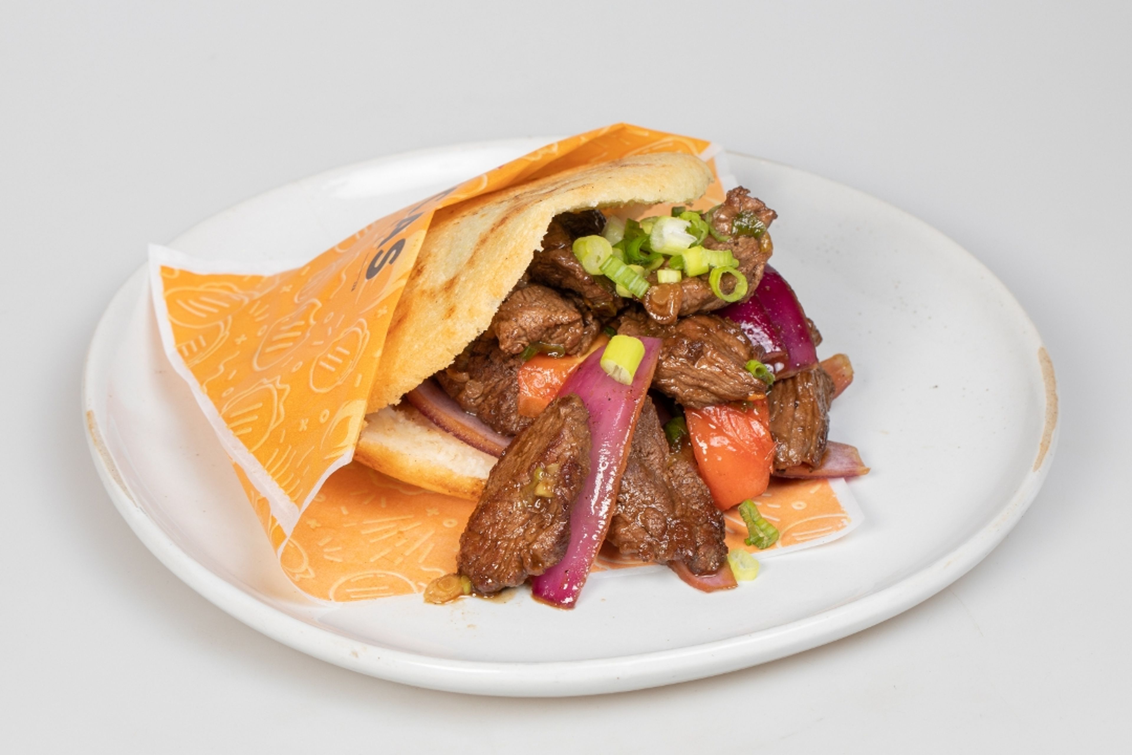 Arepa Wok Smoked Lomo Steak.