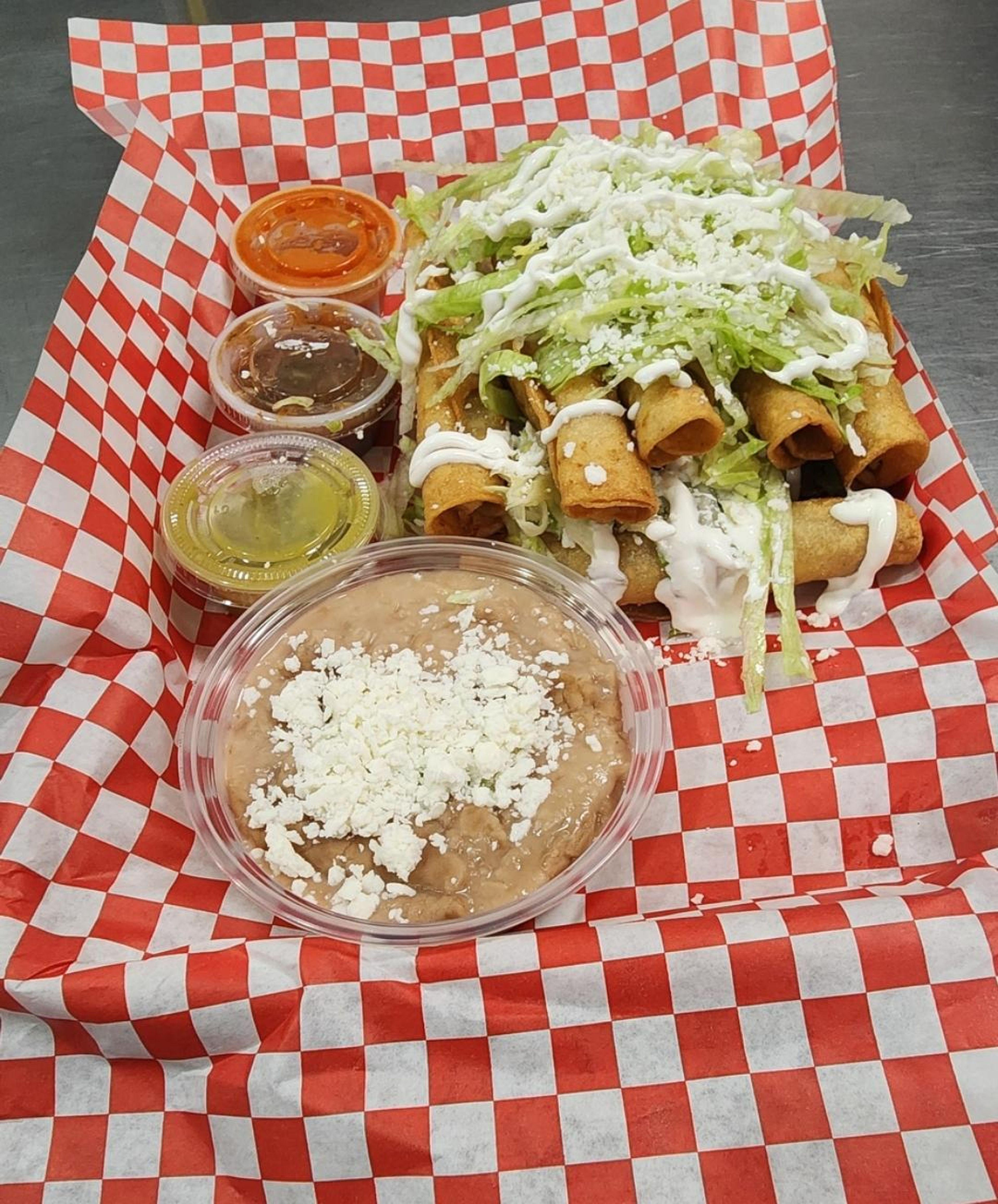 10 Taquitos platter and beans.