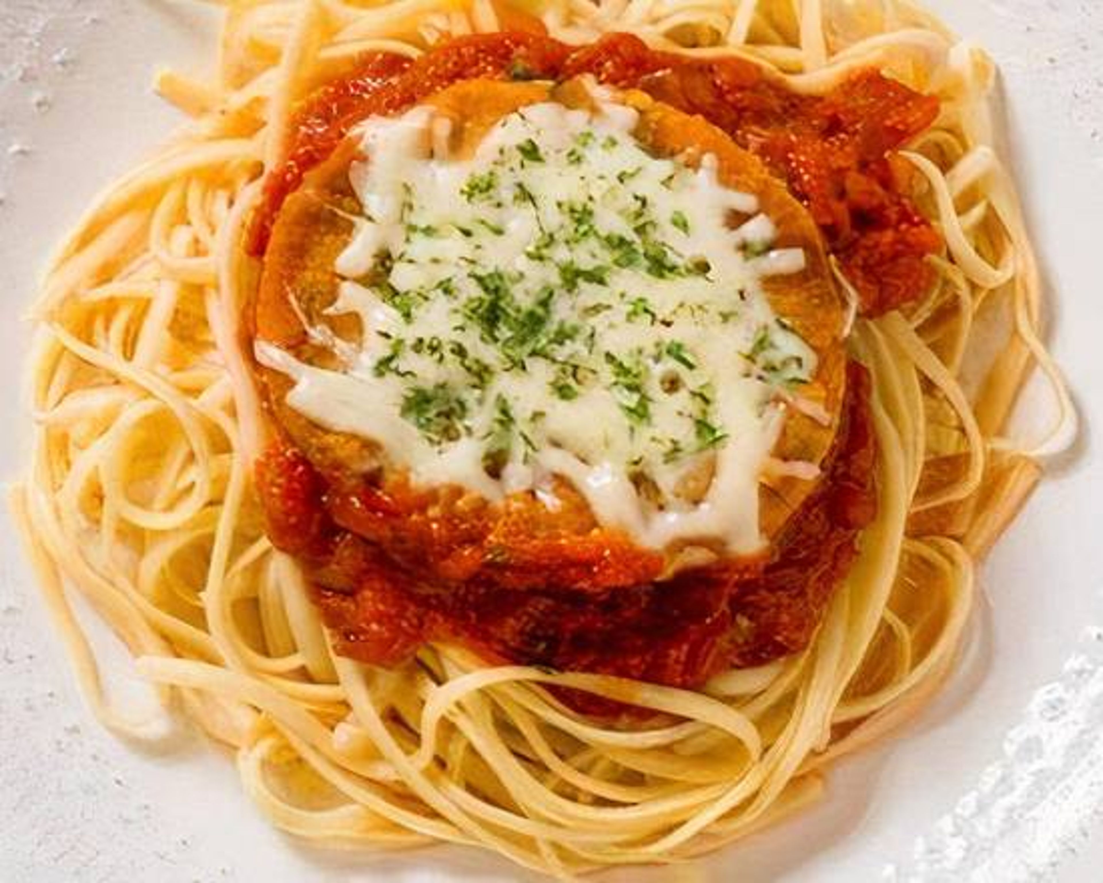 Chicken Parmesan over Spaghetti.
