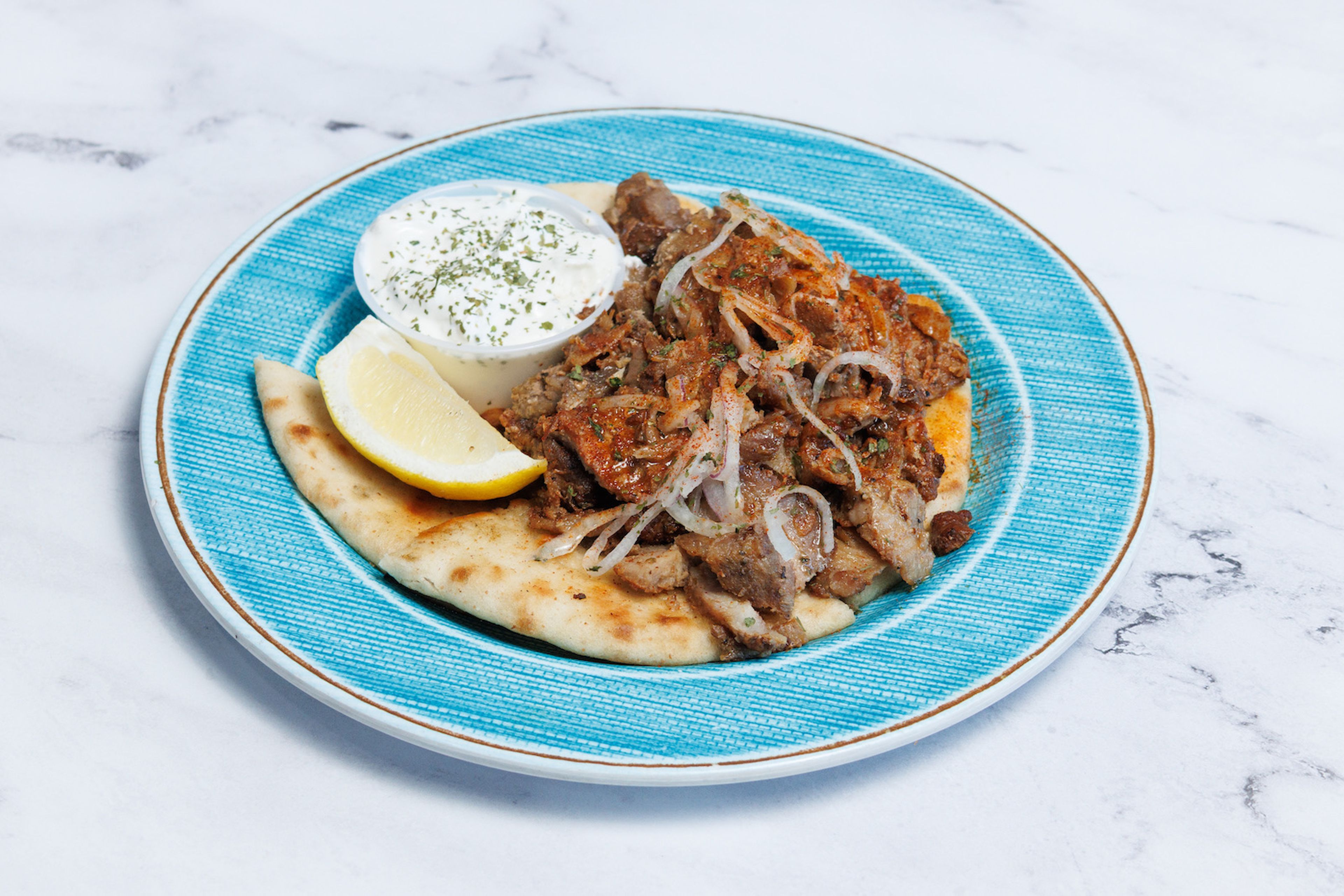 TRADITIONAL GREEK GYRO MEAT W/ PITA & TZATZIKI.