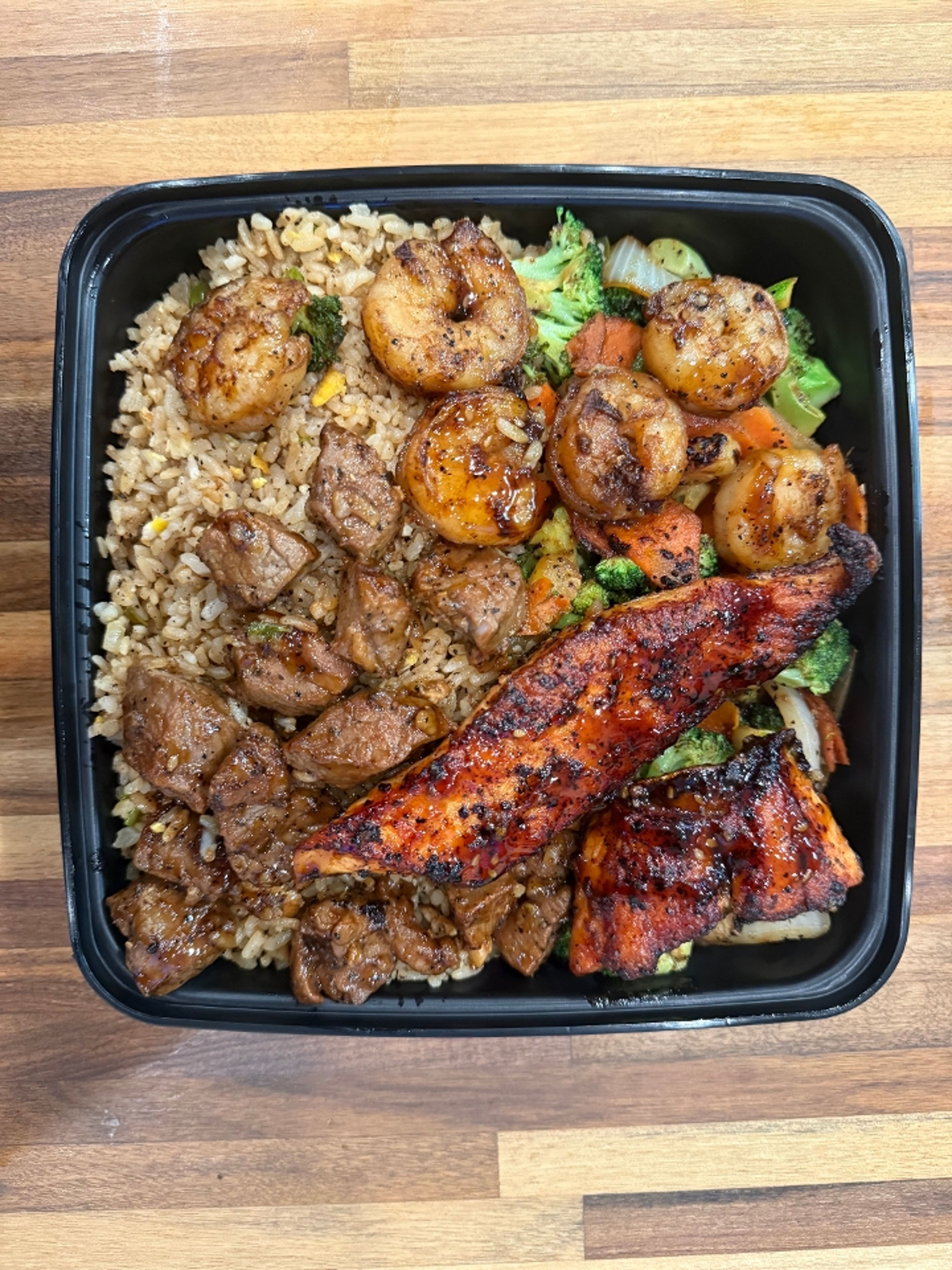 Steak, Shrimp, Salmon Trio Bowl.