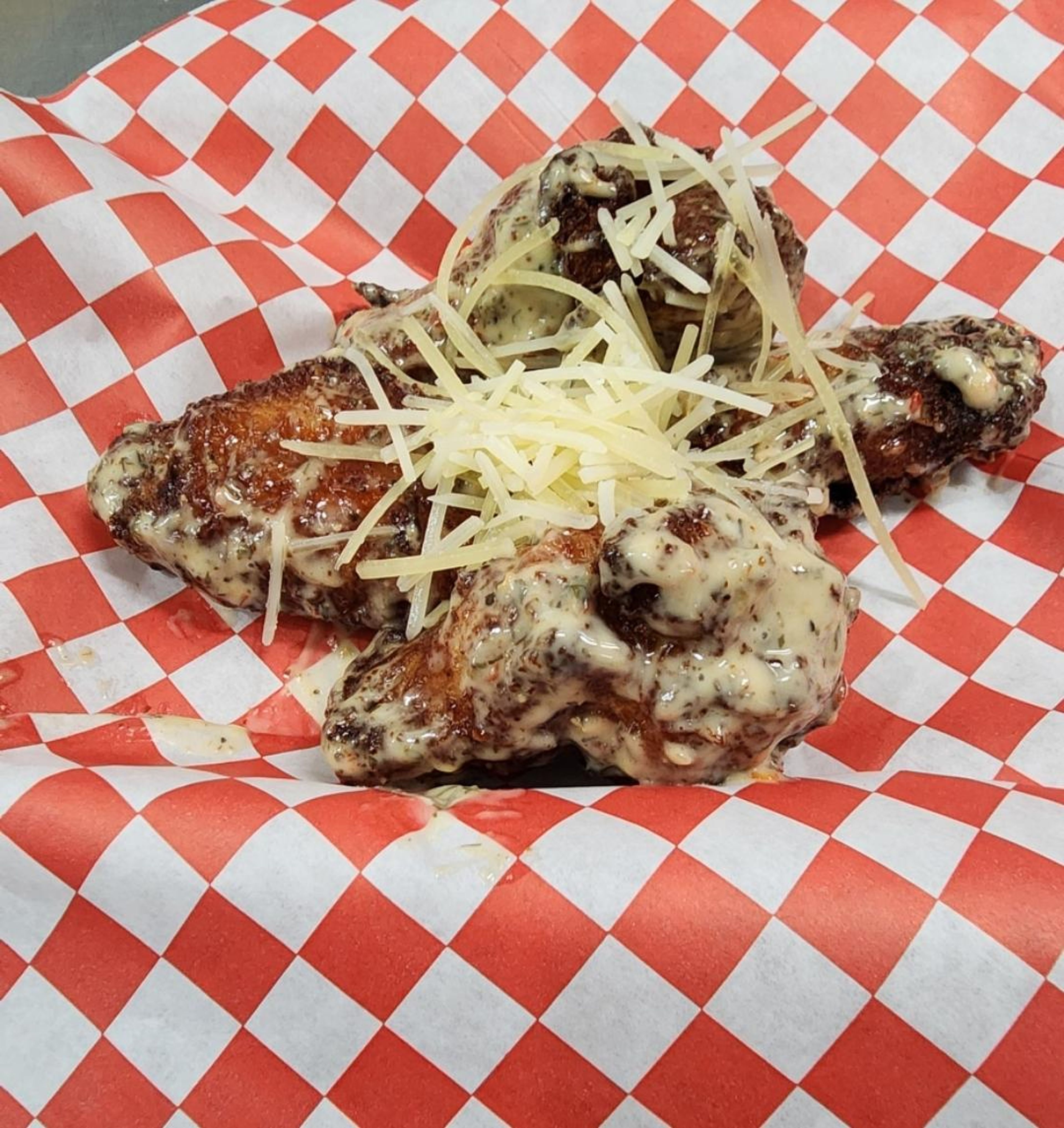 Garlic PARMESAN  WINGS , topped with Parmesan cheese.