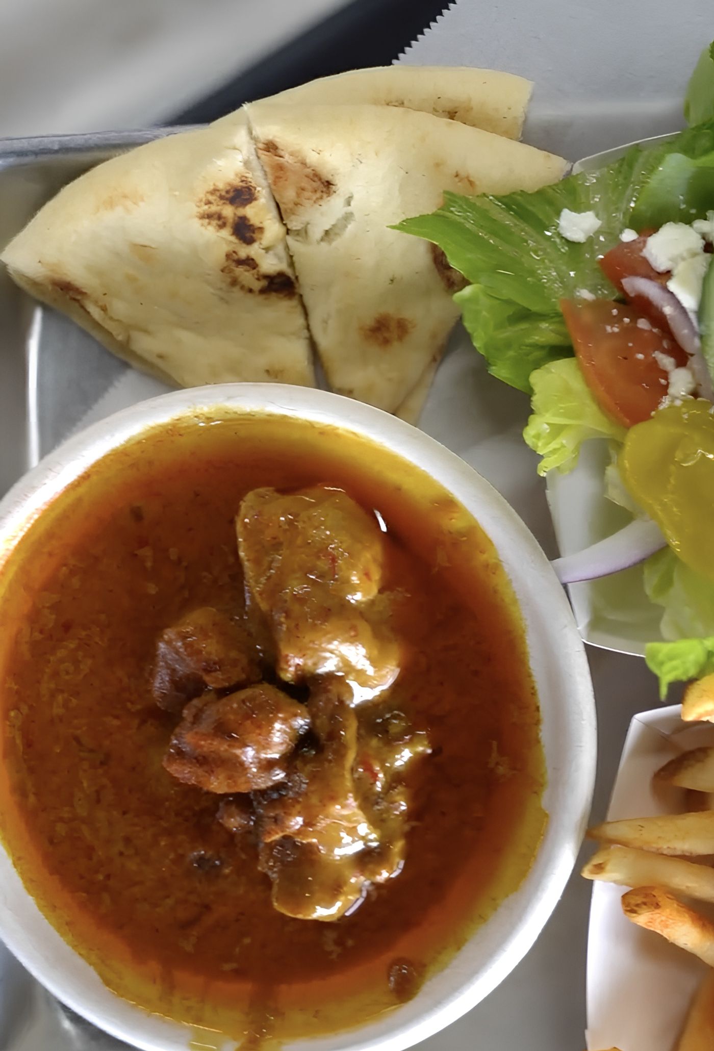 SIDE OF CHICKEN CURRY.