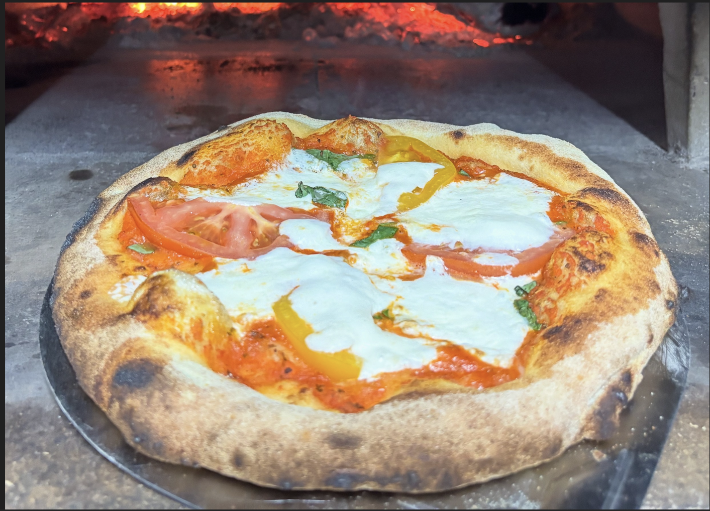 Margherita Pizza (Tomatoes, Buffalo Mozzerella).