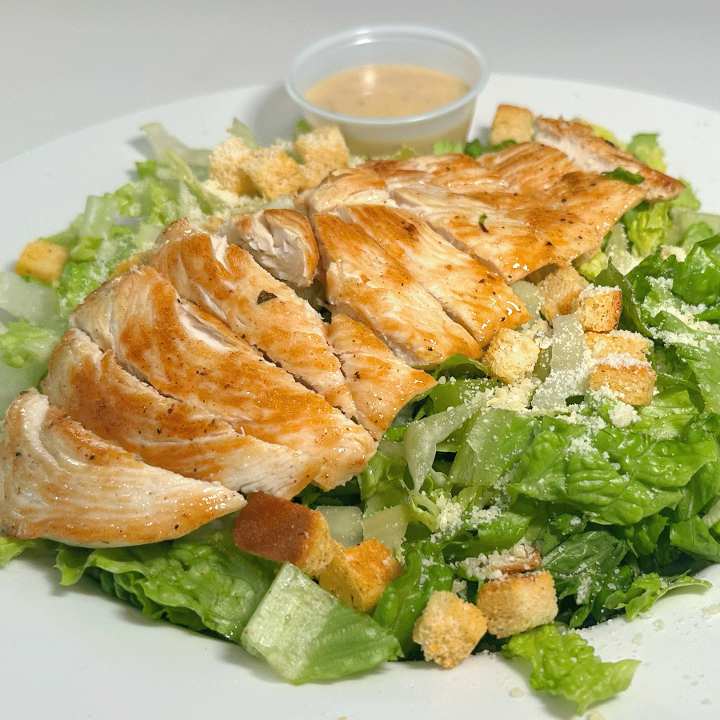 CAESAR SALAD W/ GRILLED CHICKEN.