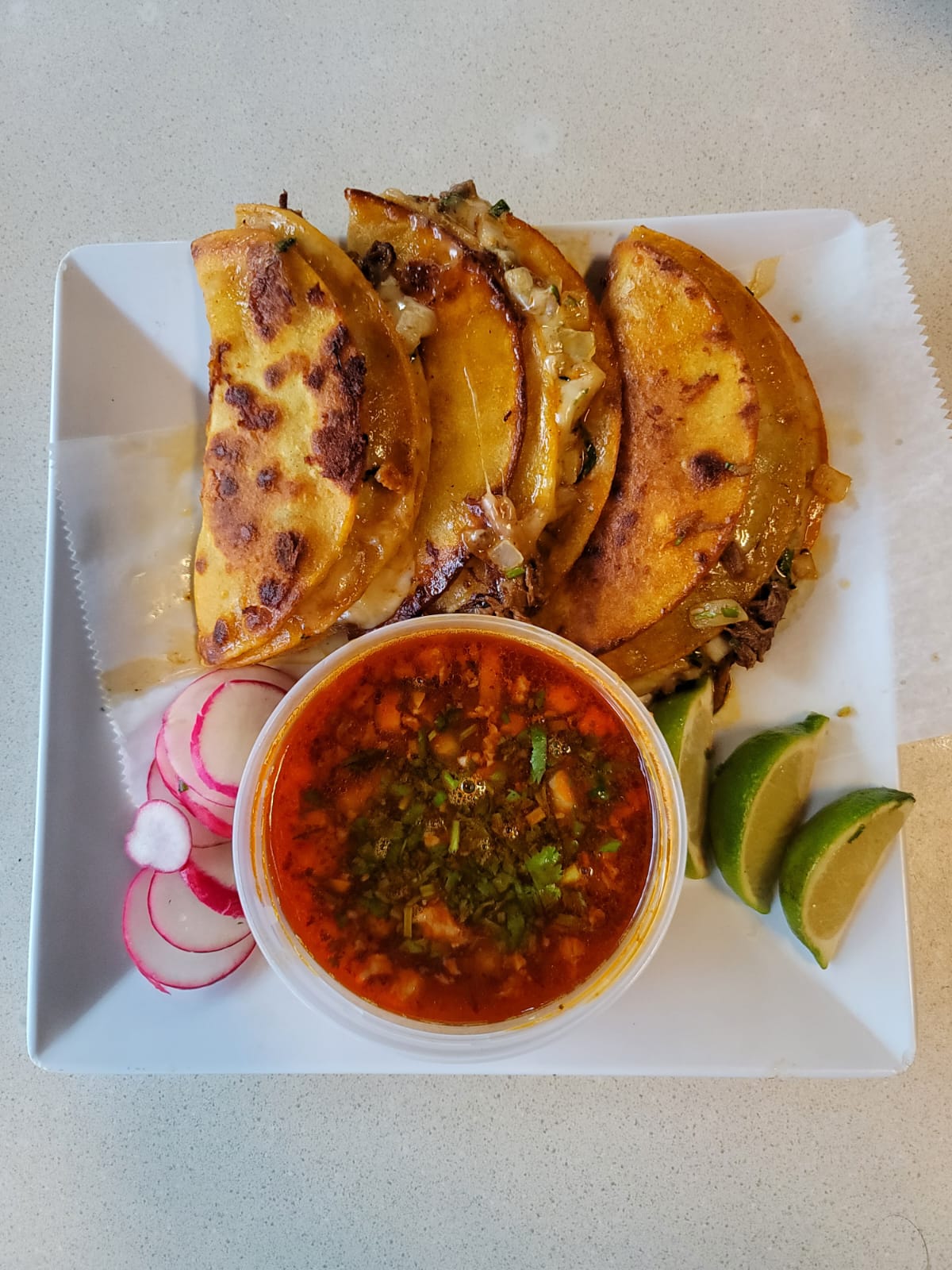 3 Birria and Cheese Tacos with Consomé.