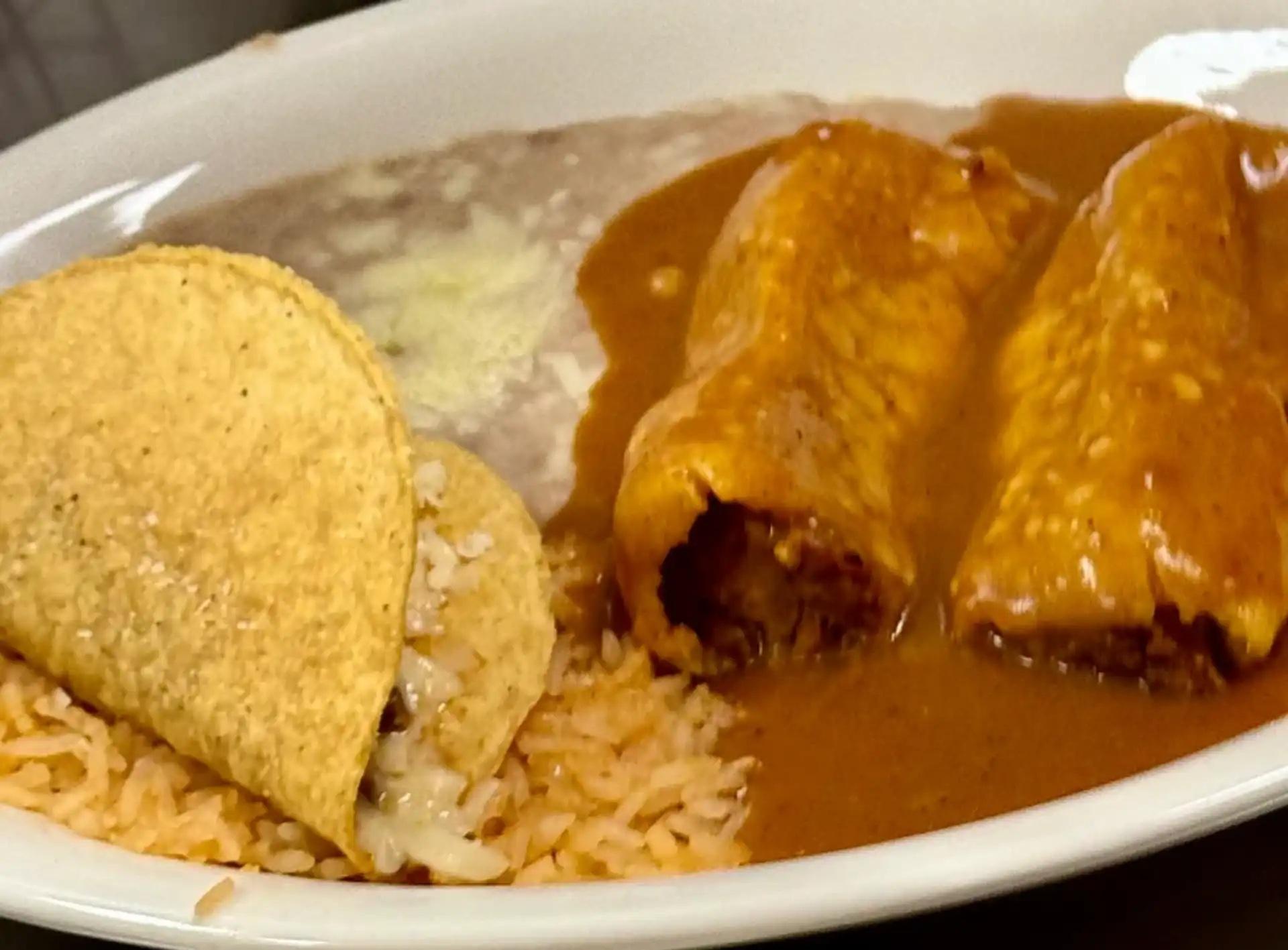 Two Tamales, Taco, Rice & Beans.