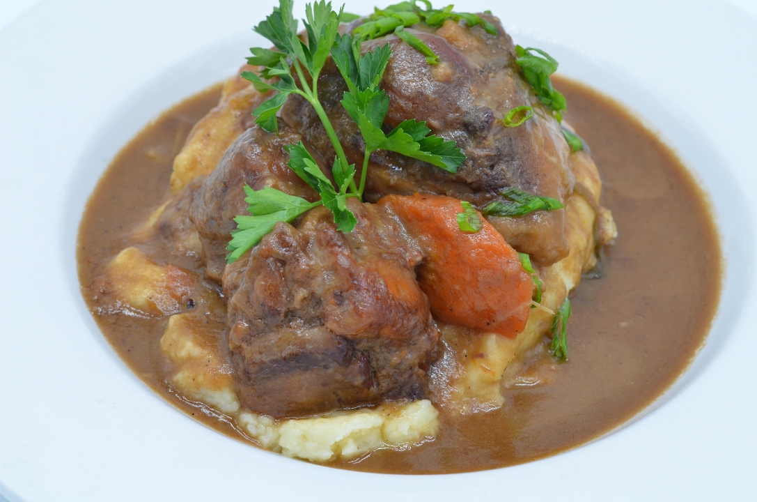 SOUTHERN SMOTHERED OXTAILS.