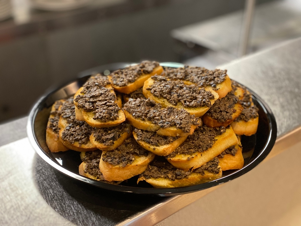 Crostini with Olives Walnuts Tapenade.