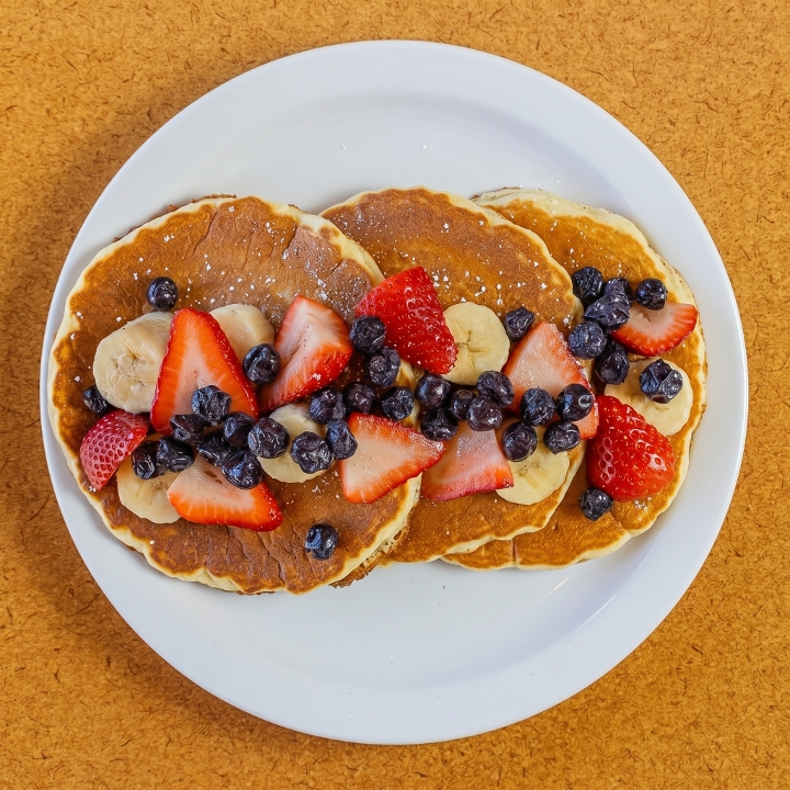 Pancakes with Strawberries, Blueberries and Bananas.