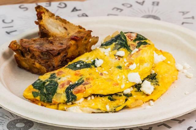 Greek Omelette, served with Home Fries and a Bagel.