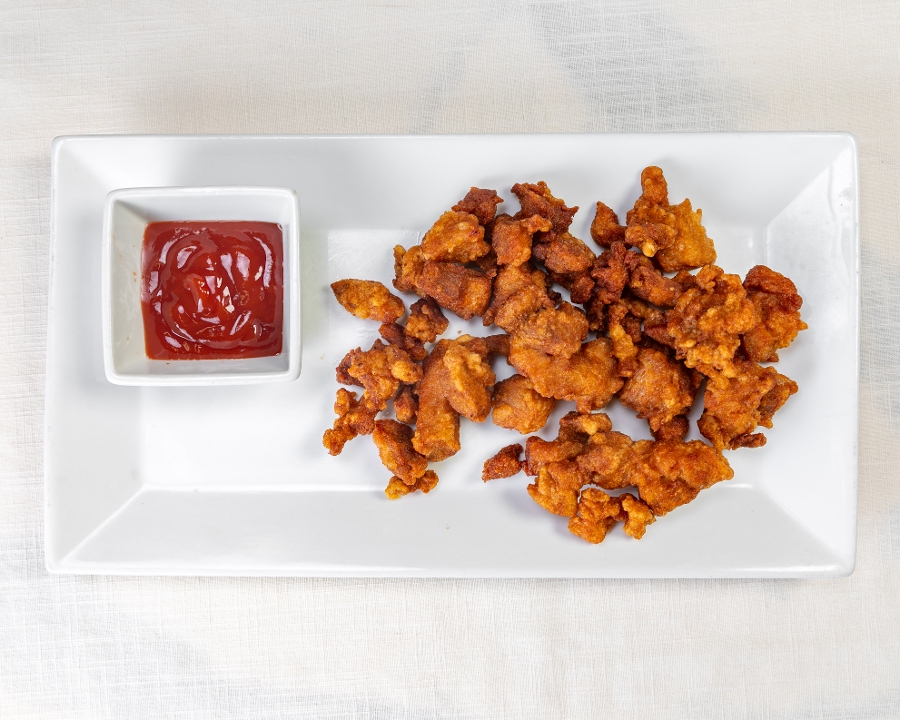 Popcorn Chicken Served W/ Ketchup.