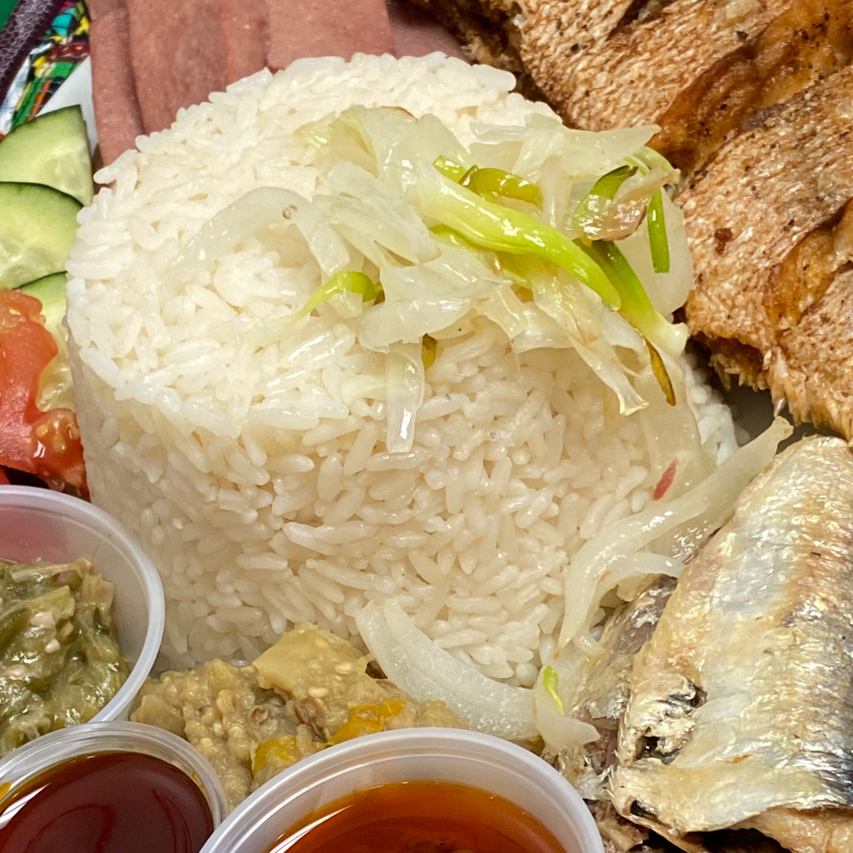 Liberian Dry Rice served with Fish or Chicken (Beniseed & Okra on the Side).