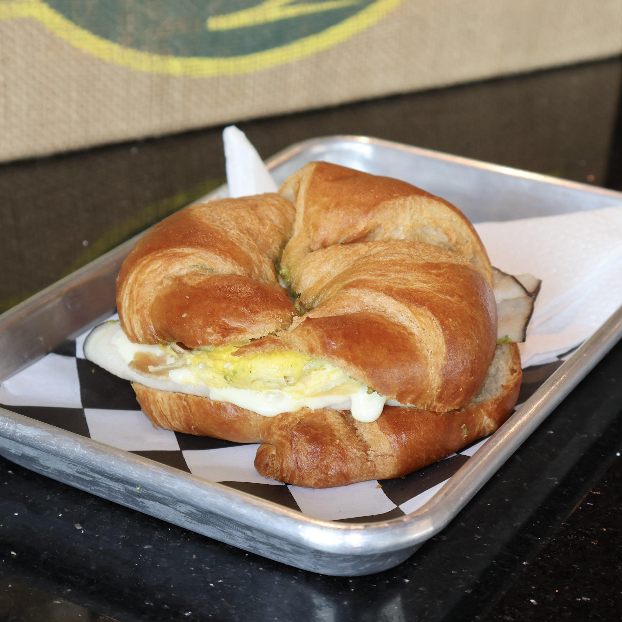 Turkey Pesto (with egg) - Turkey Bacon Egg Pesto Croissant (TBEPC).