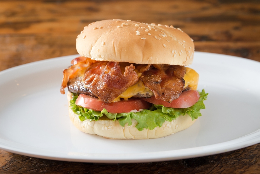Bacon Cheeseburger with Fries and Soda Can.