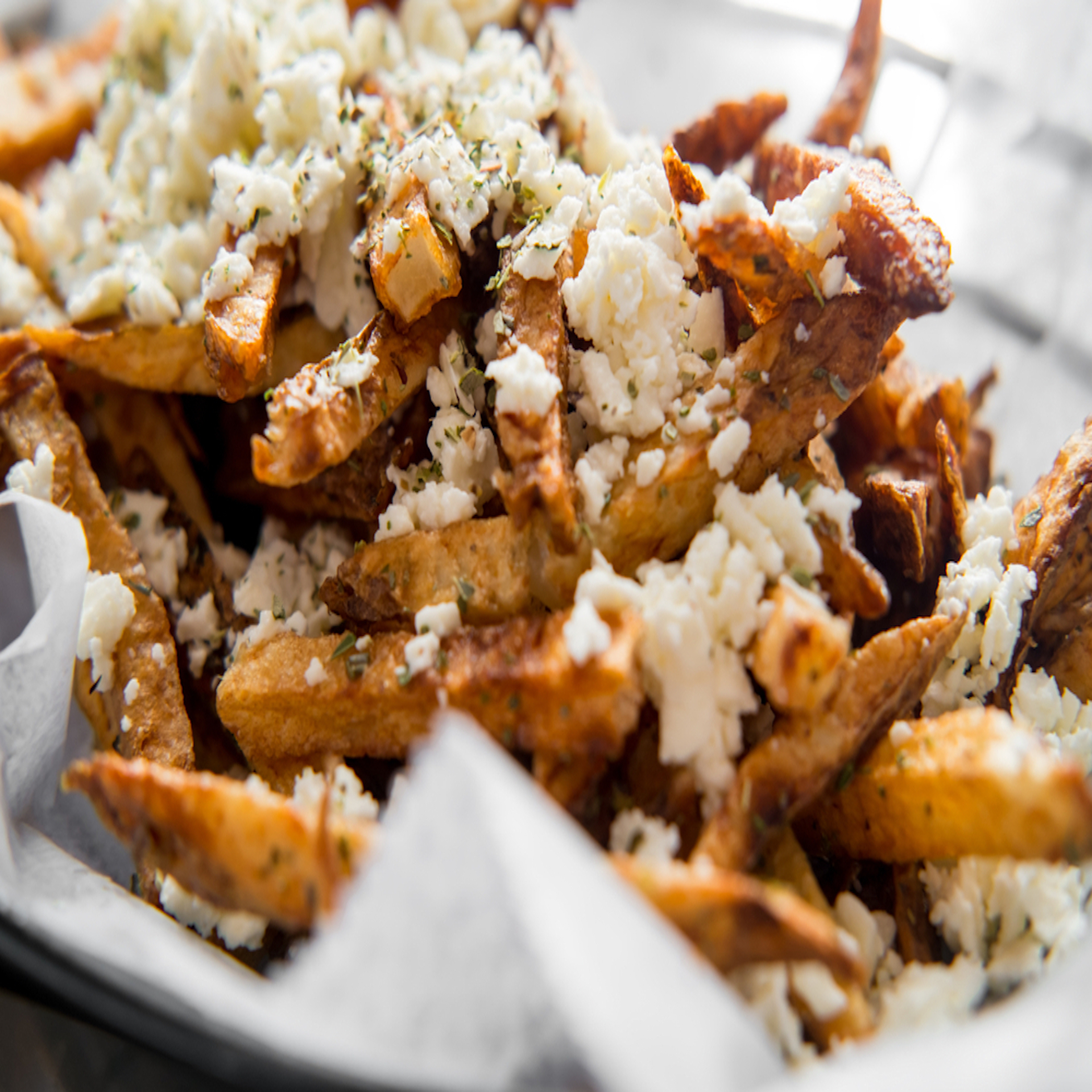 GREEK FRIES W/ FETA CHEESE.