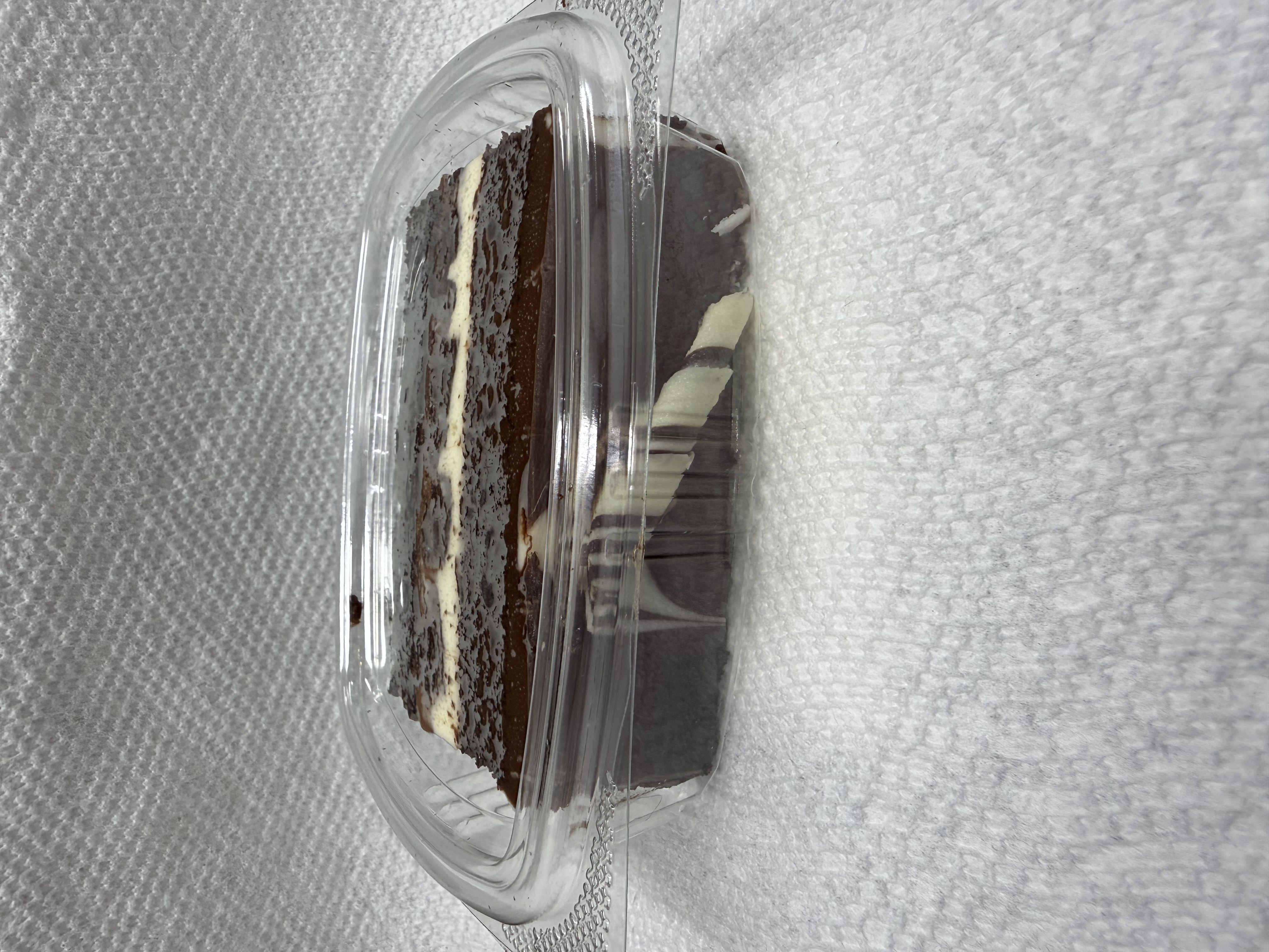 Tuxed Chocolate Mousse Cake Slice.