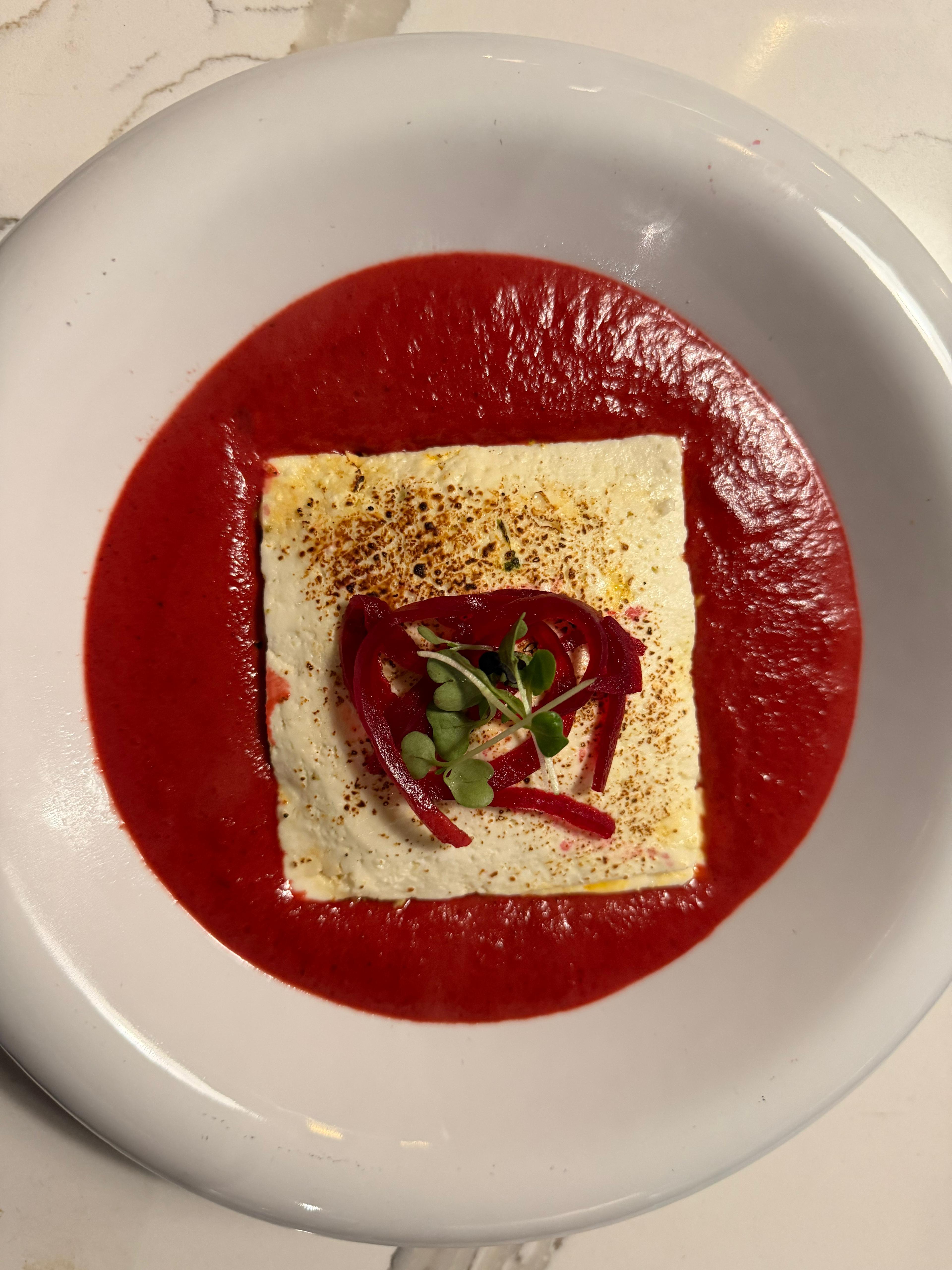 Paneer Lasagna With Beetroot Sauce.