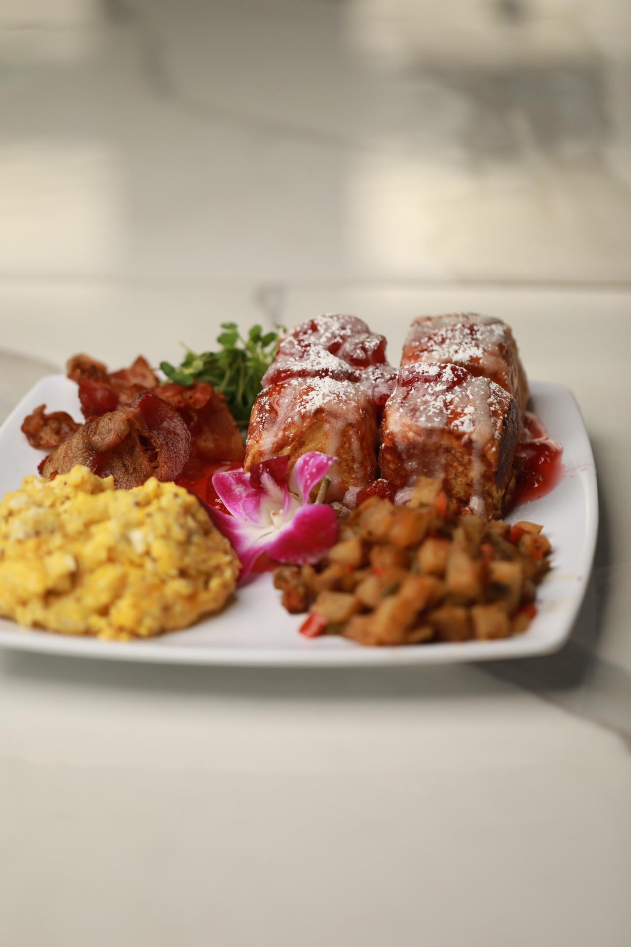 Strawberries & Crème Smotherd French Toast.