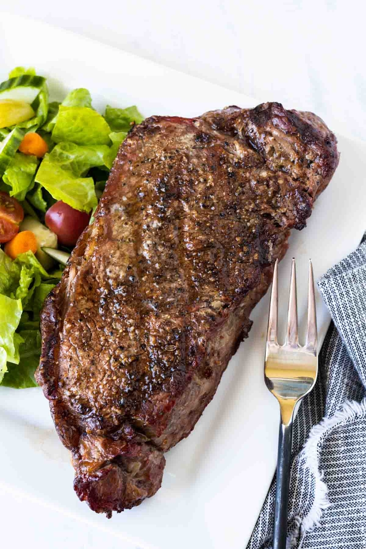 16oz Bone In Angus NY Strip Steak.